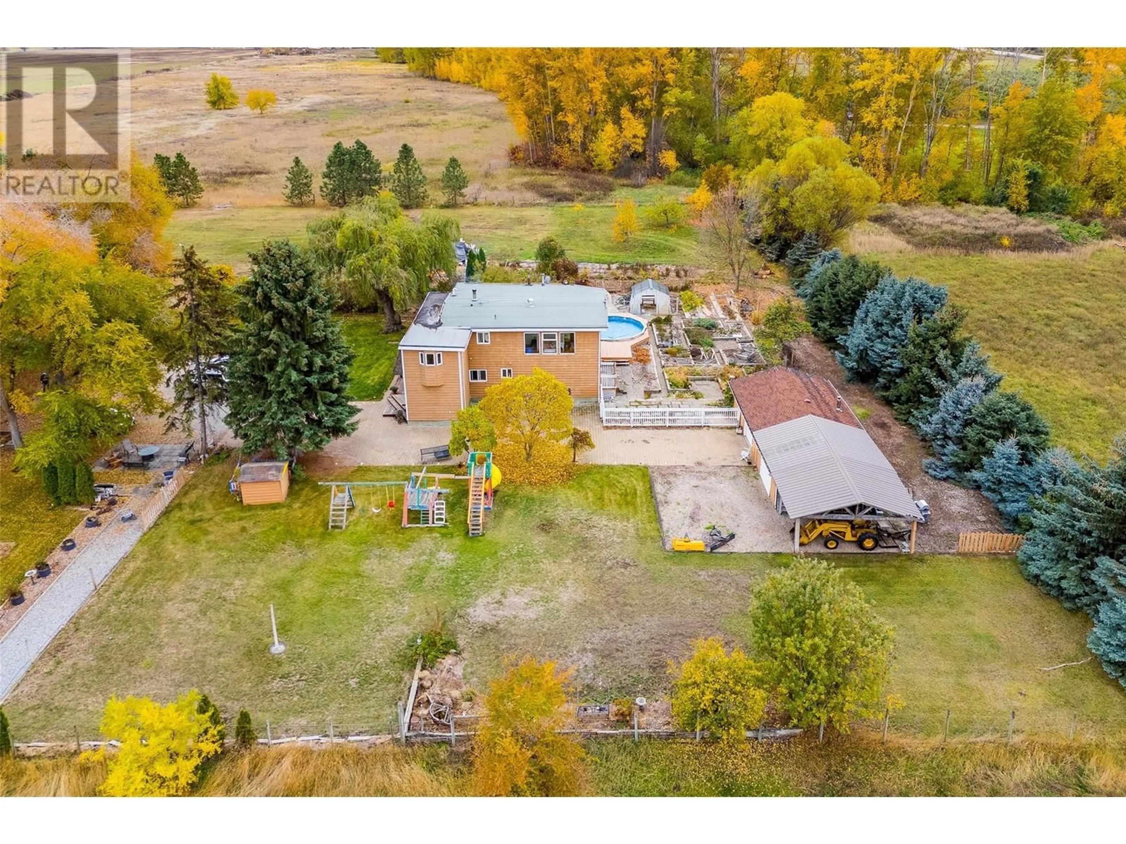 A pic from exterior of the house or condo, the fenced backyard for 11024 Reiswig Road, Lake Country British Columbia V4V1X3