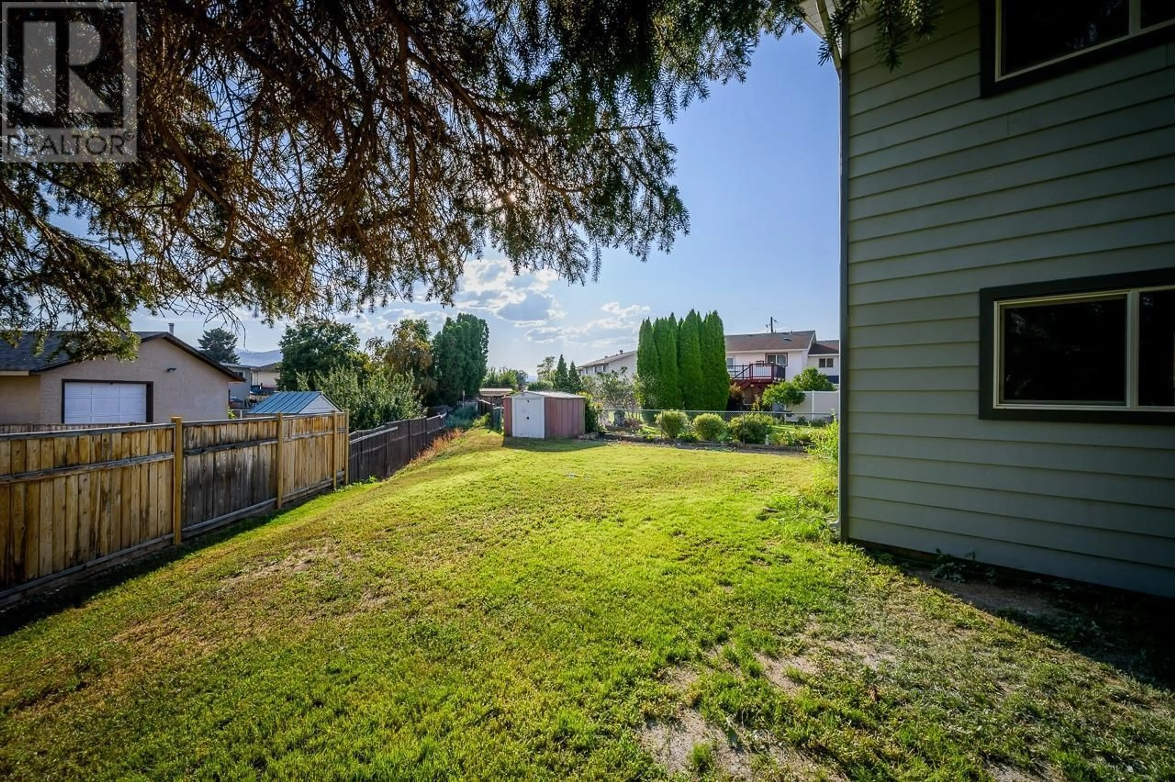 A pic from exterior of the house or condo, the fenced backyard for 2663 YOUNG Place, Kamloops British Columbia V2B8A4