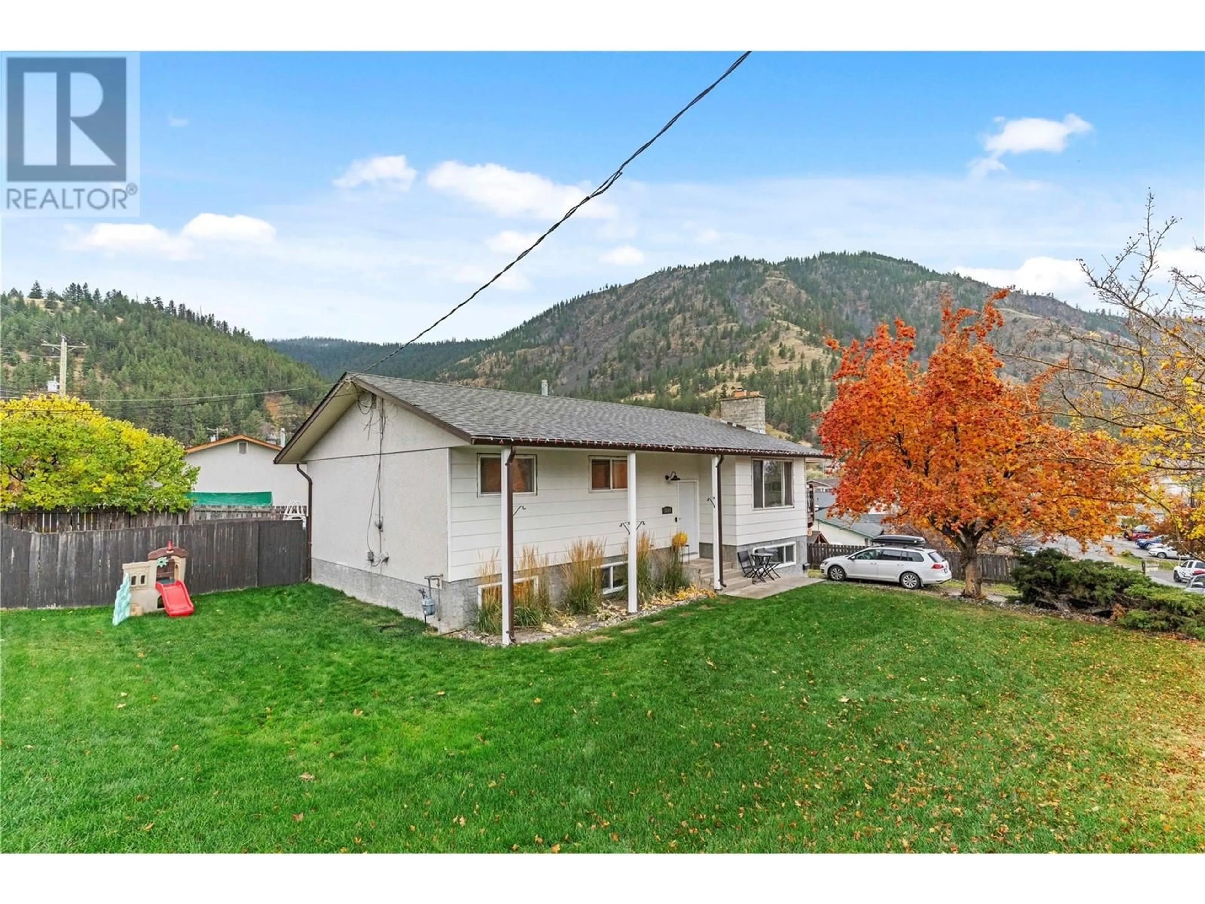 Frontside or backside of a home, the fenced backyard for 5849 LEONARD Place, Kamloops British Columbia V2C5S9