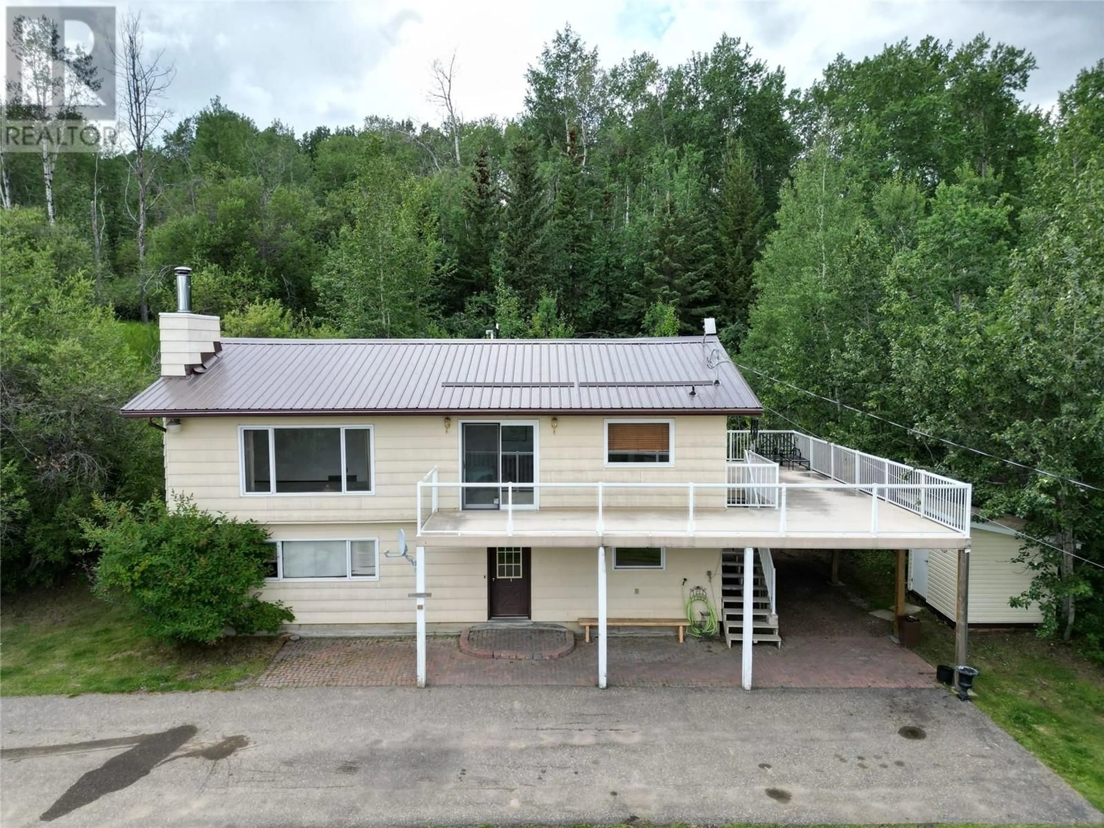 Frontside or backside of a home, cottage for 13357 Trail Way, Dawson Creek British Columbia V1G0C2