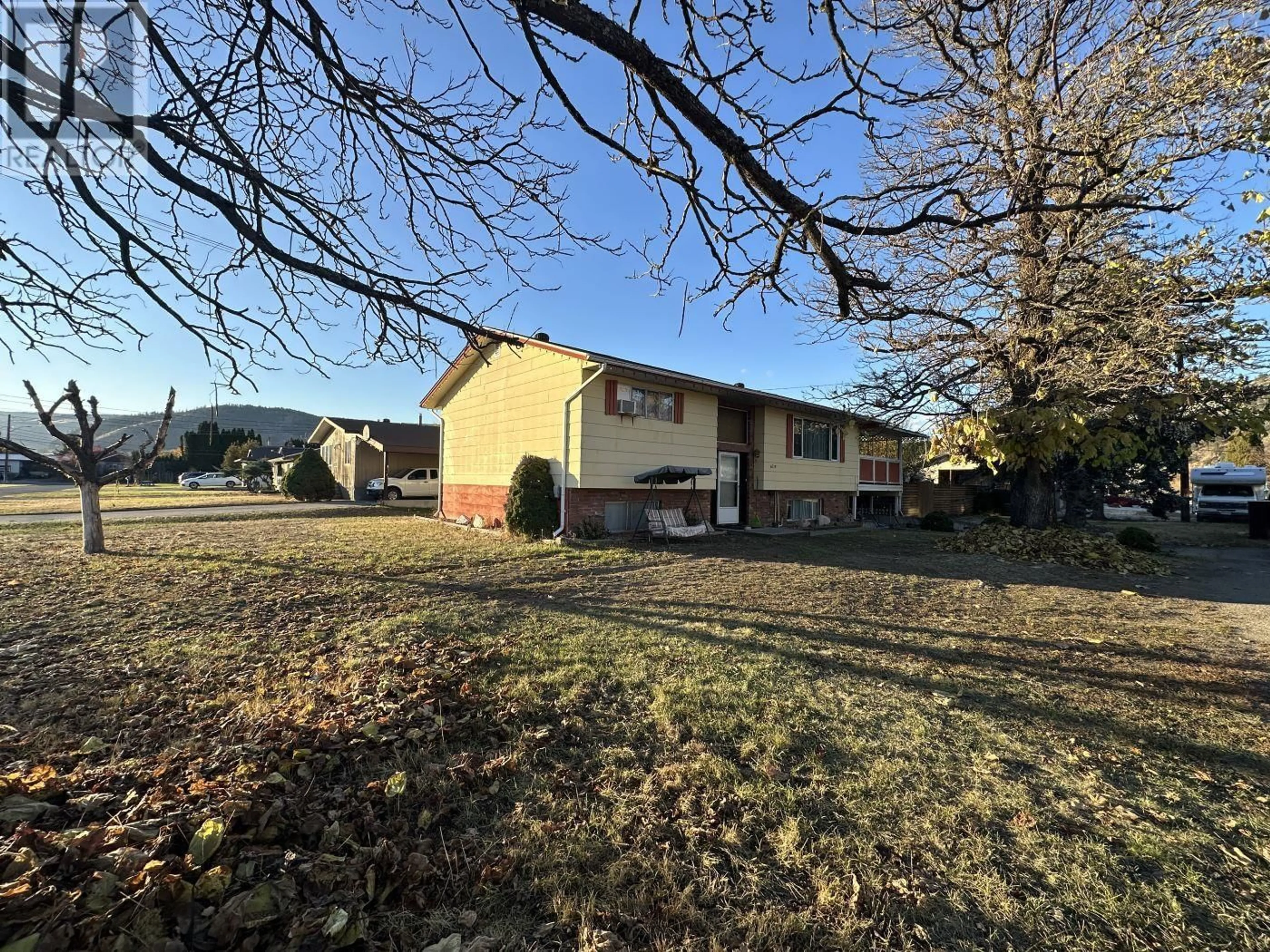 A pic from exterior of the house or condo, the fenced backyard for 6729 14th Street, Grand Forks British Columbia V0H1H0