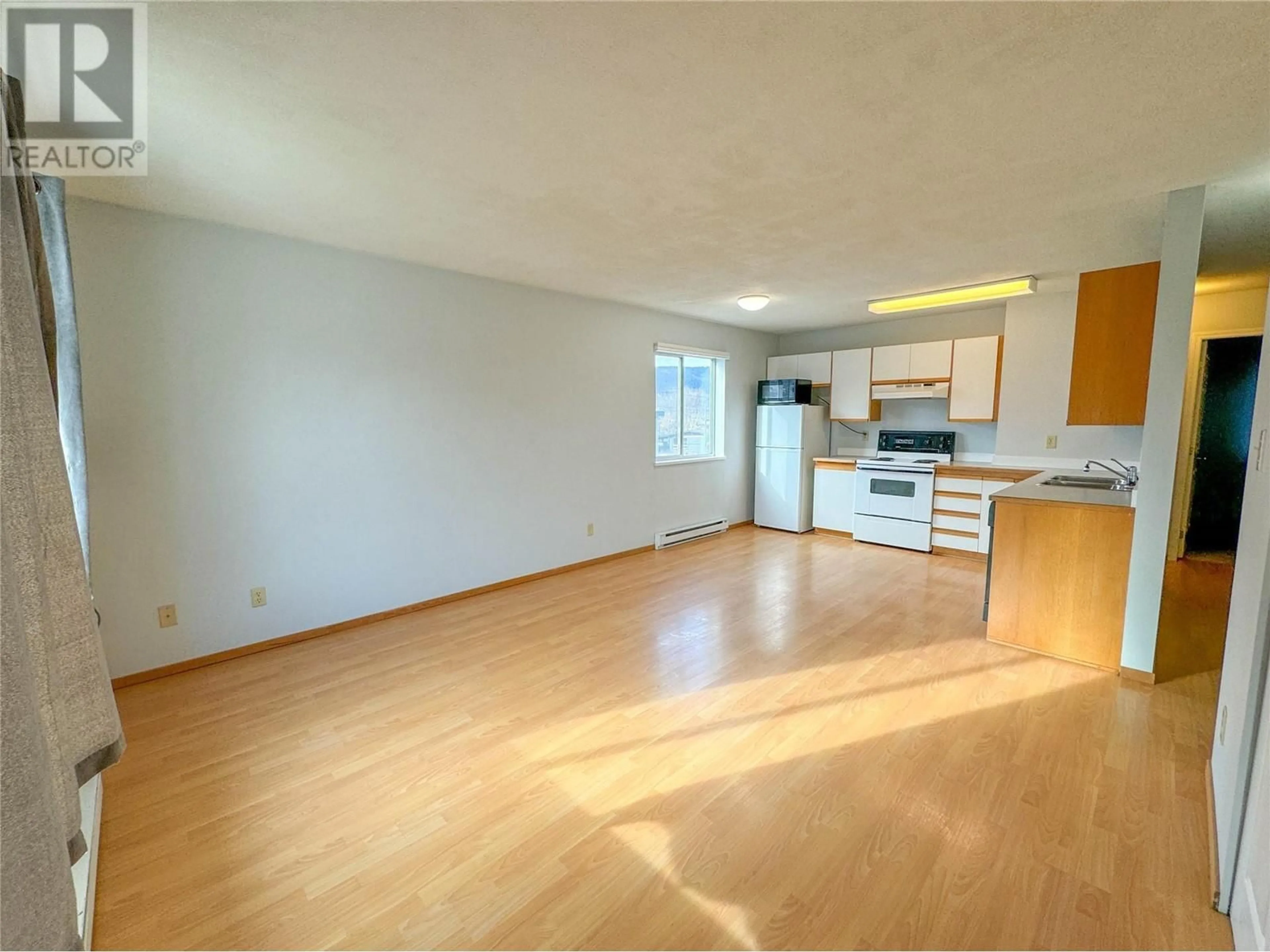 A pic of a room, wood floors for 2295 Blair Street Unit# 212, Merritt British Columbia V1K1B8