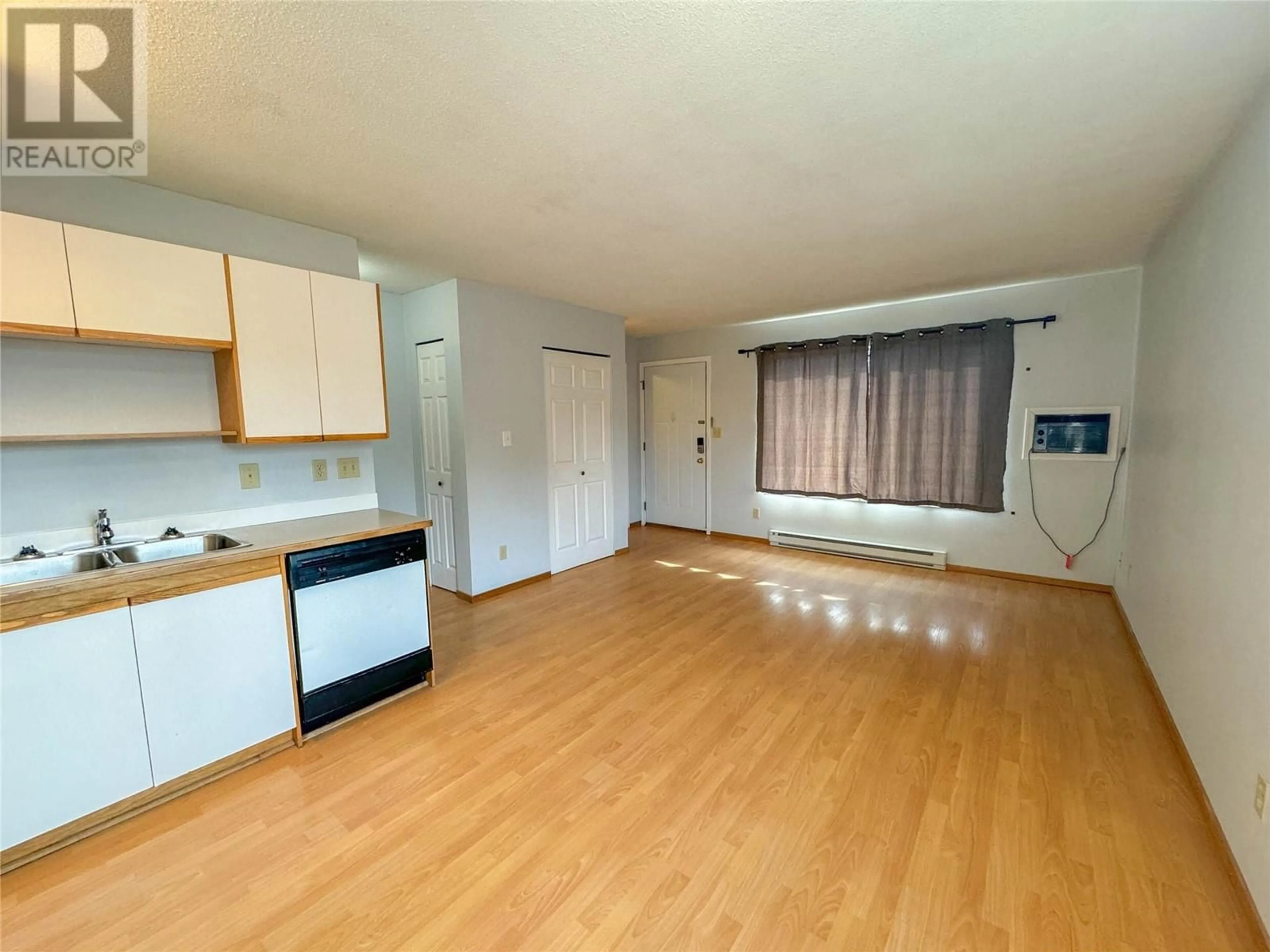 A pic of a room, wood floors for 2295 Blair Street Unit# 212, Merritt British Columbia V1K1B8