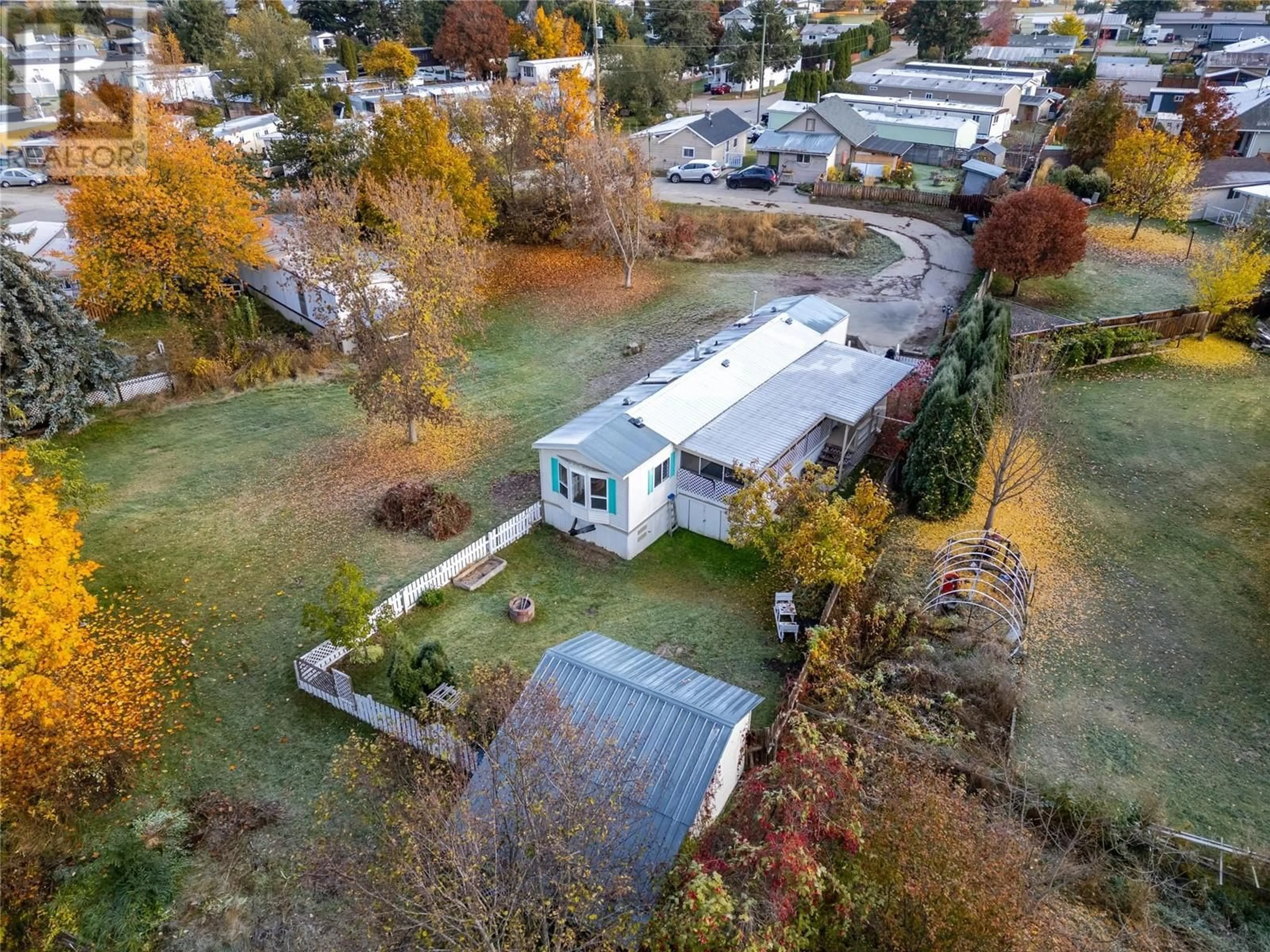 A pic from exterior of the house or condo, the fenced backyard for 504 PINE Street Unit# 35, Chase British Columbia V0E1M0