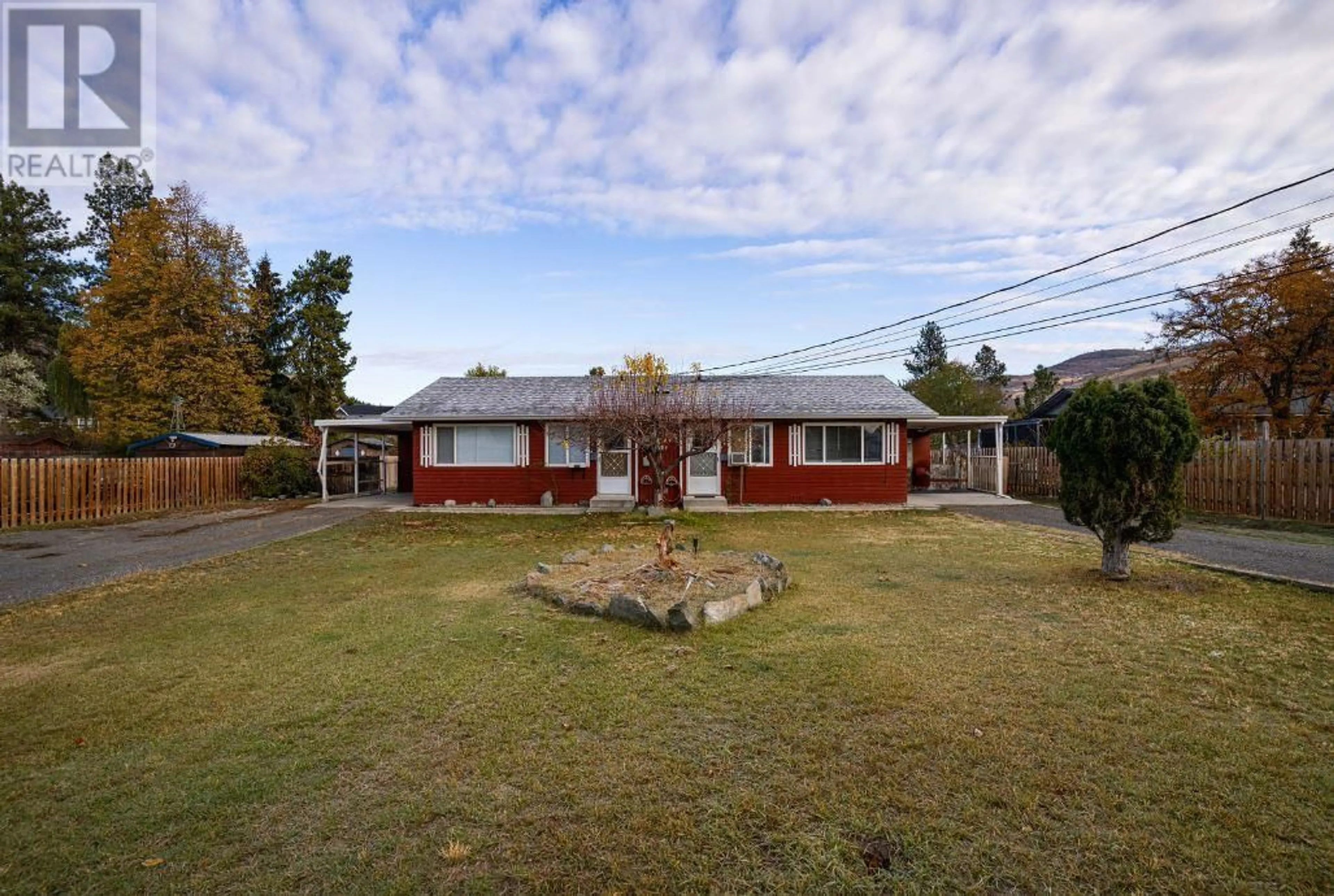 Frontside or backside of a home, the fenced backyard for 666/668 Reemon Drive, Kamloops British Columbia V2B6T1