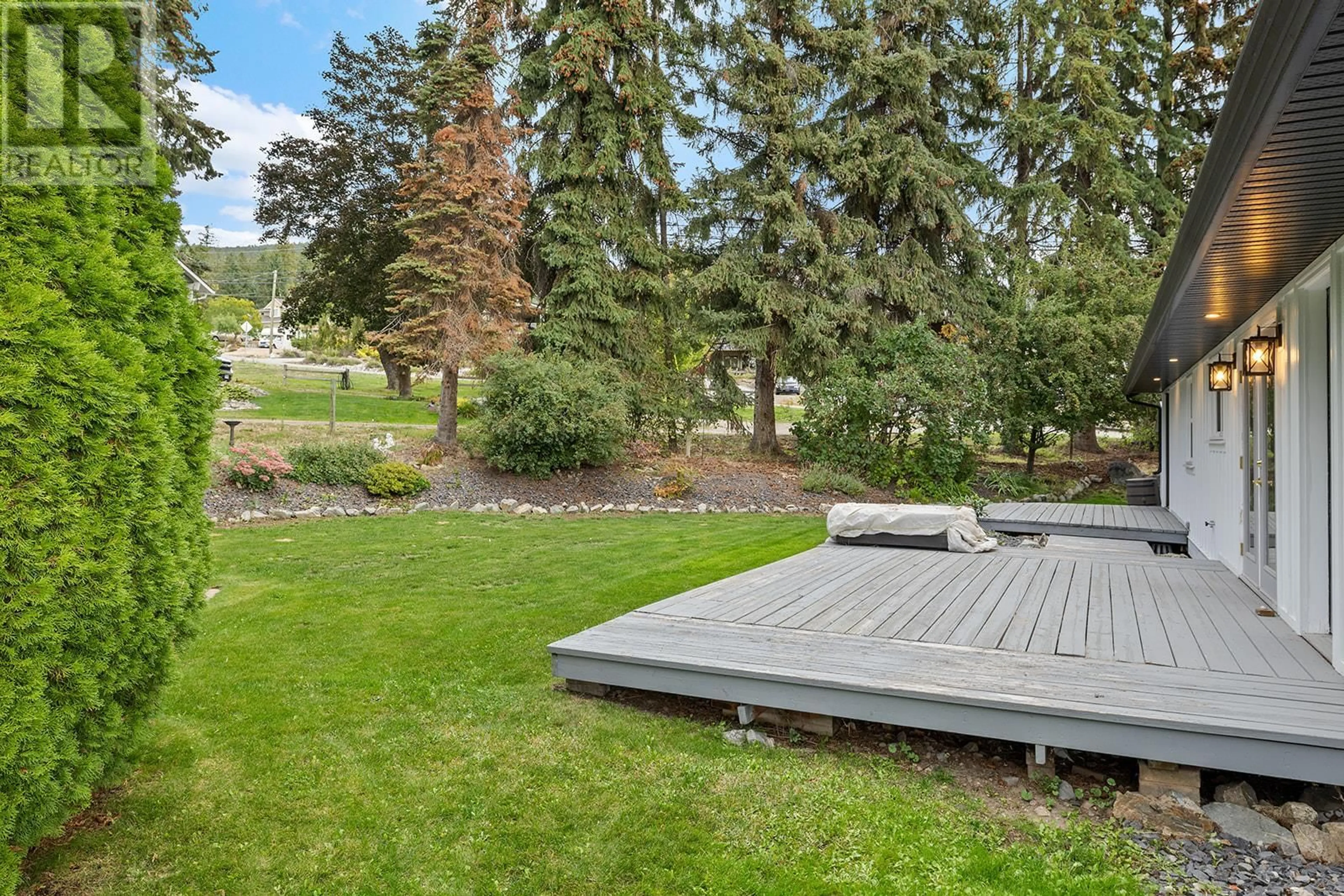 Patio, the fenced backyard for 3154 Smith Creek Road, West Kelowna British Columbia V4T1M7