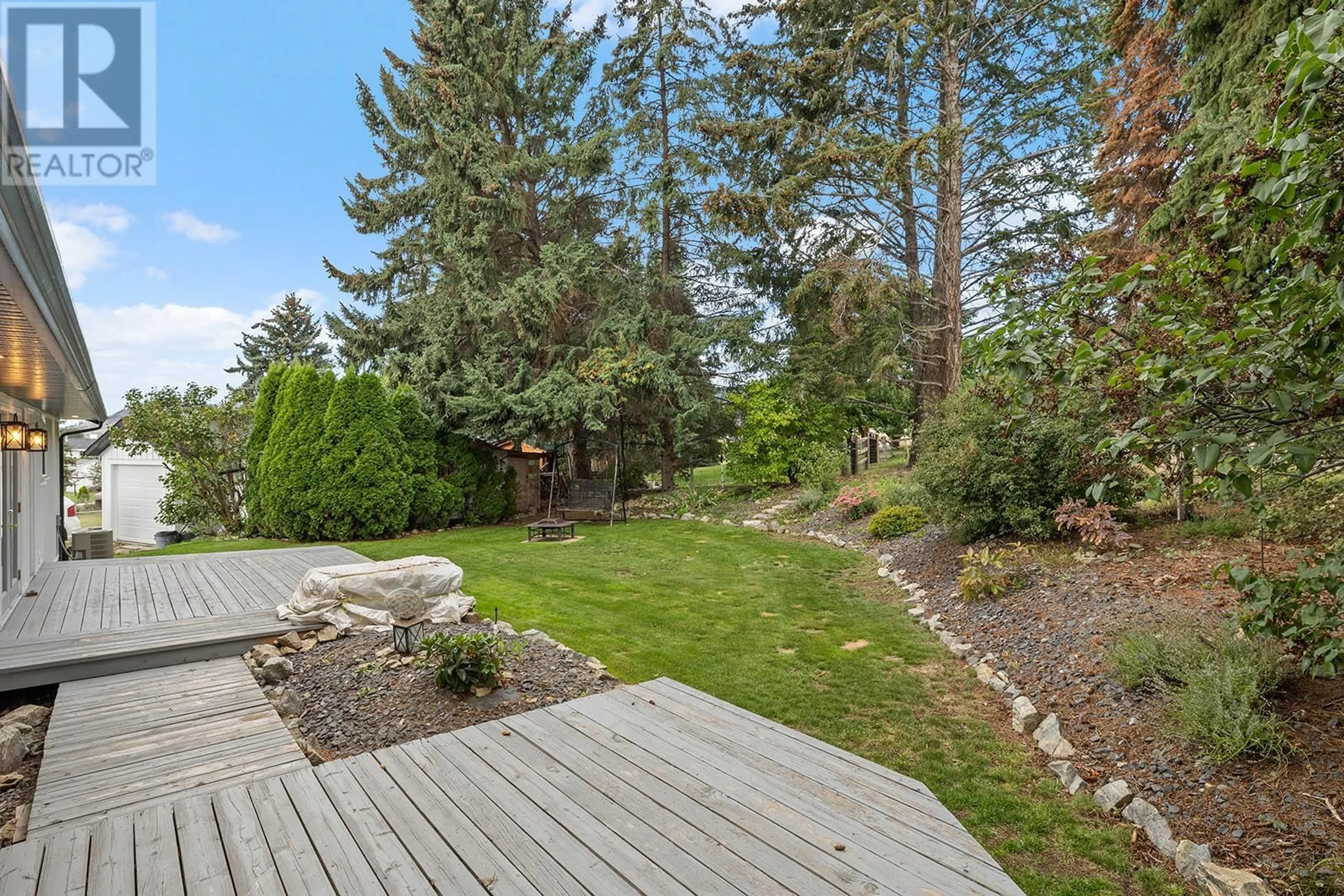 Patio, the fenced backyard for 3154 Smith Creek Road, West Kelowna British Columbia V4T1M7