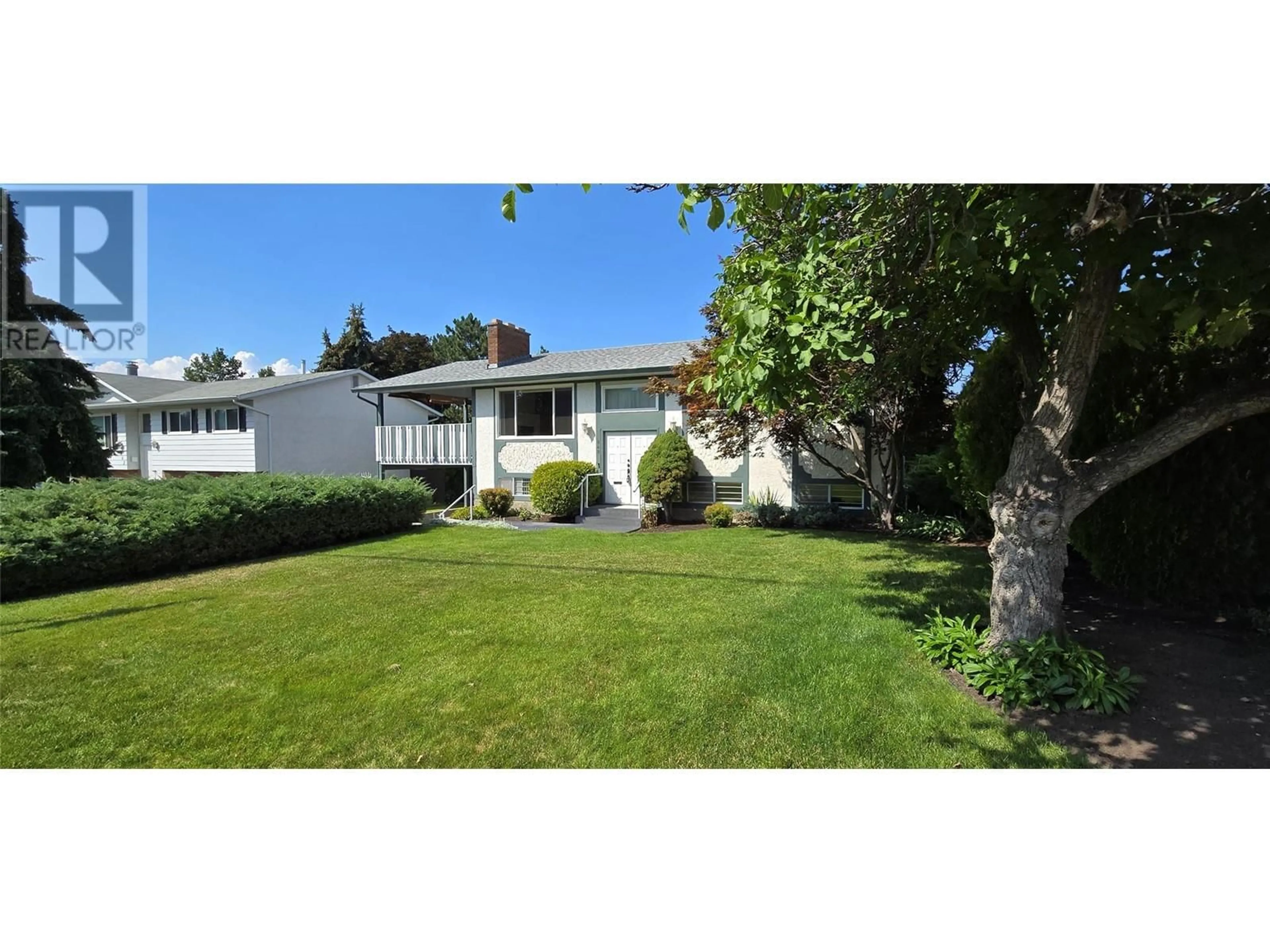 Frontside or backside of a home, the fenced backyard for 848 Hammer Avenue, Kelowna British Columbia V1W2B8