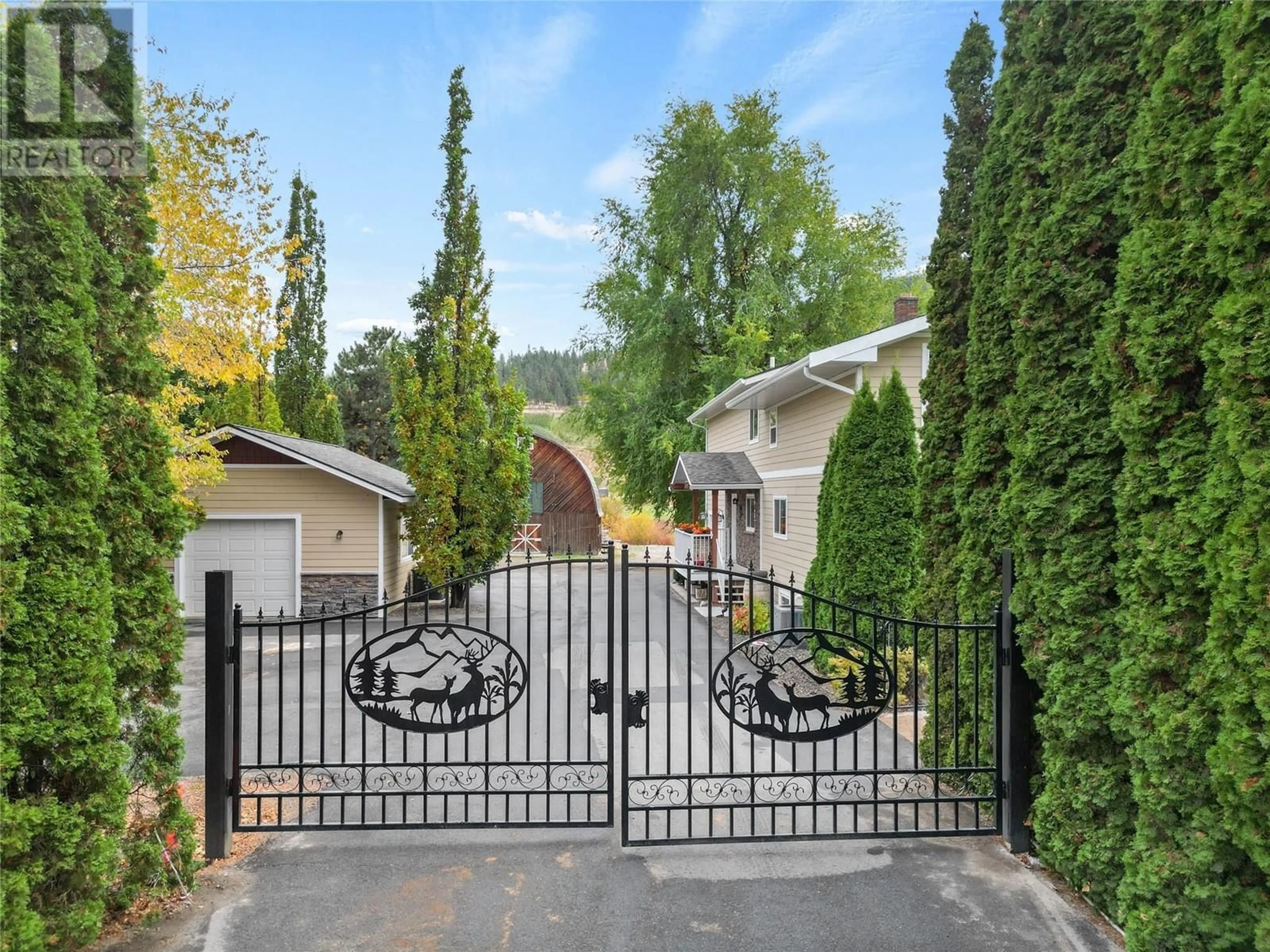 A pic from exterior of the house or condo, the fenced backyard for 13105 Dale Meadows Road, Summerland British Columbia V0H1Z8