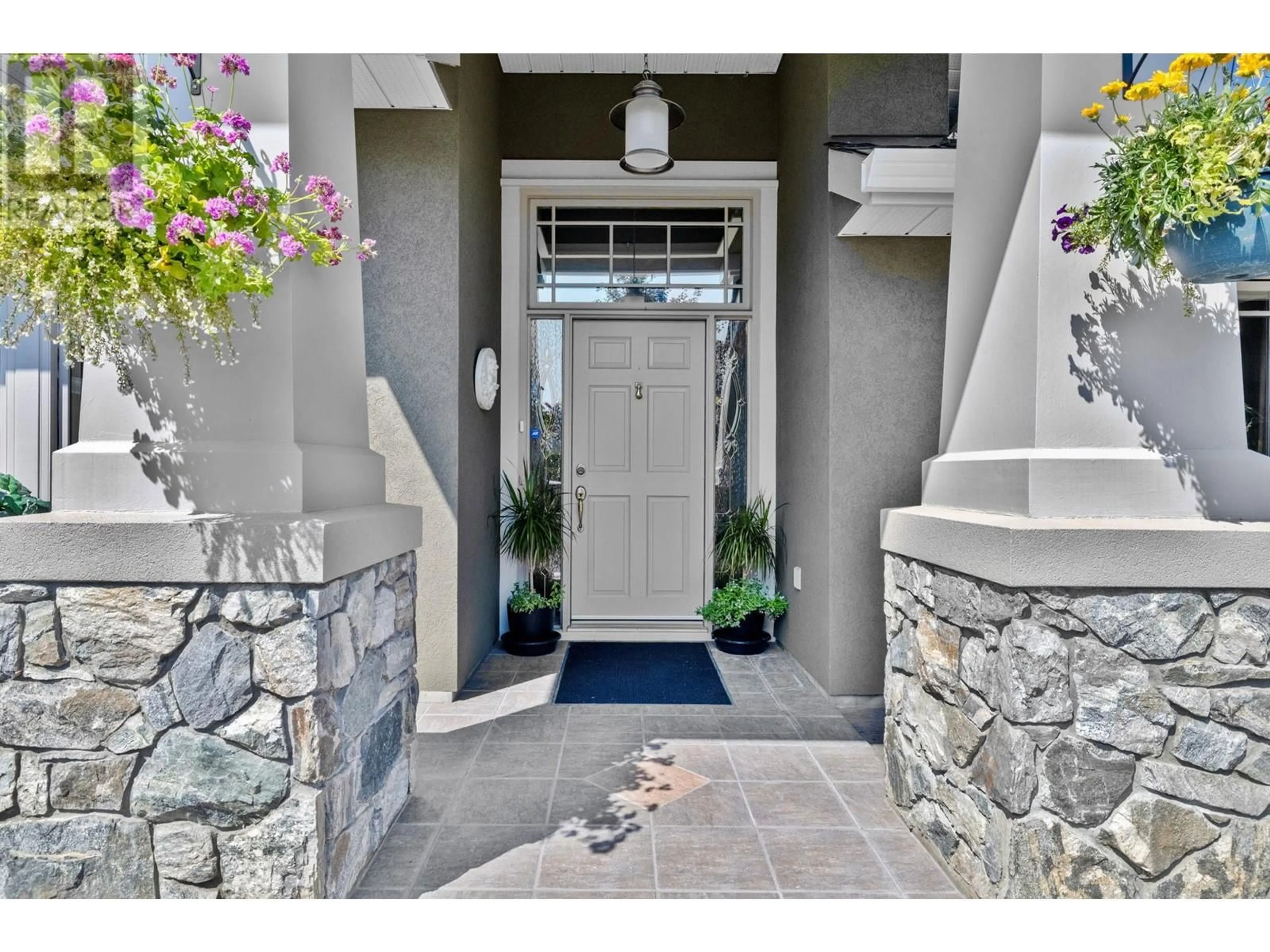 Indoor entryway, cement floor for 3945 Gallaghers Circle, Kelowna British Columbia V1W3Z9