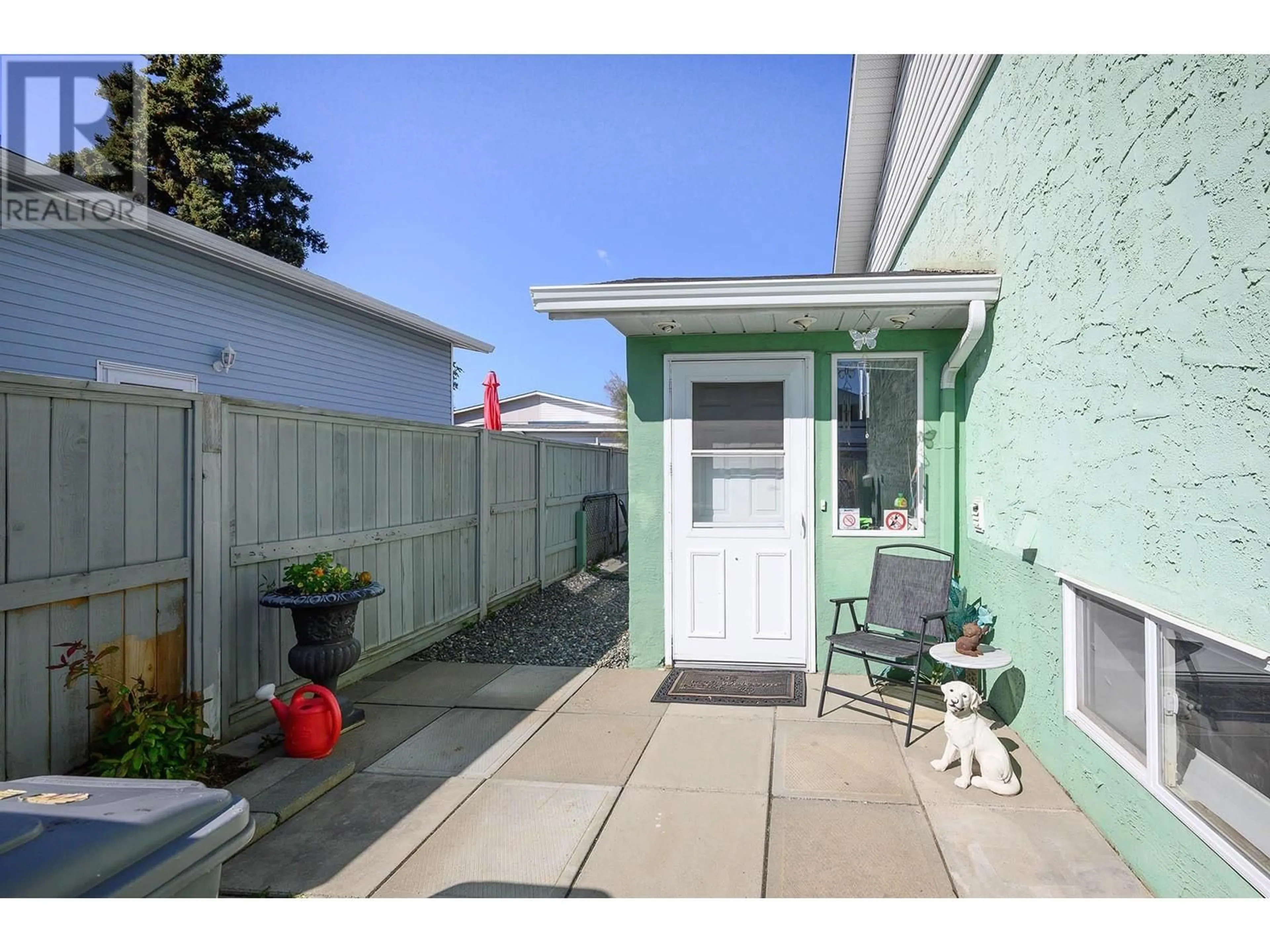 A pic from exterior of the house or condo, the fenced backyard for 1088 WINDBREAK Street, Kamloops British Columbia V2B5P9