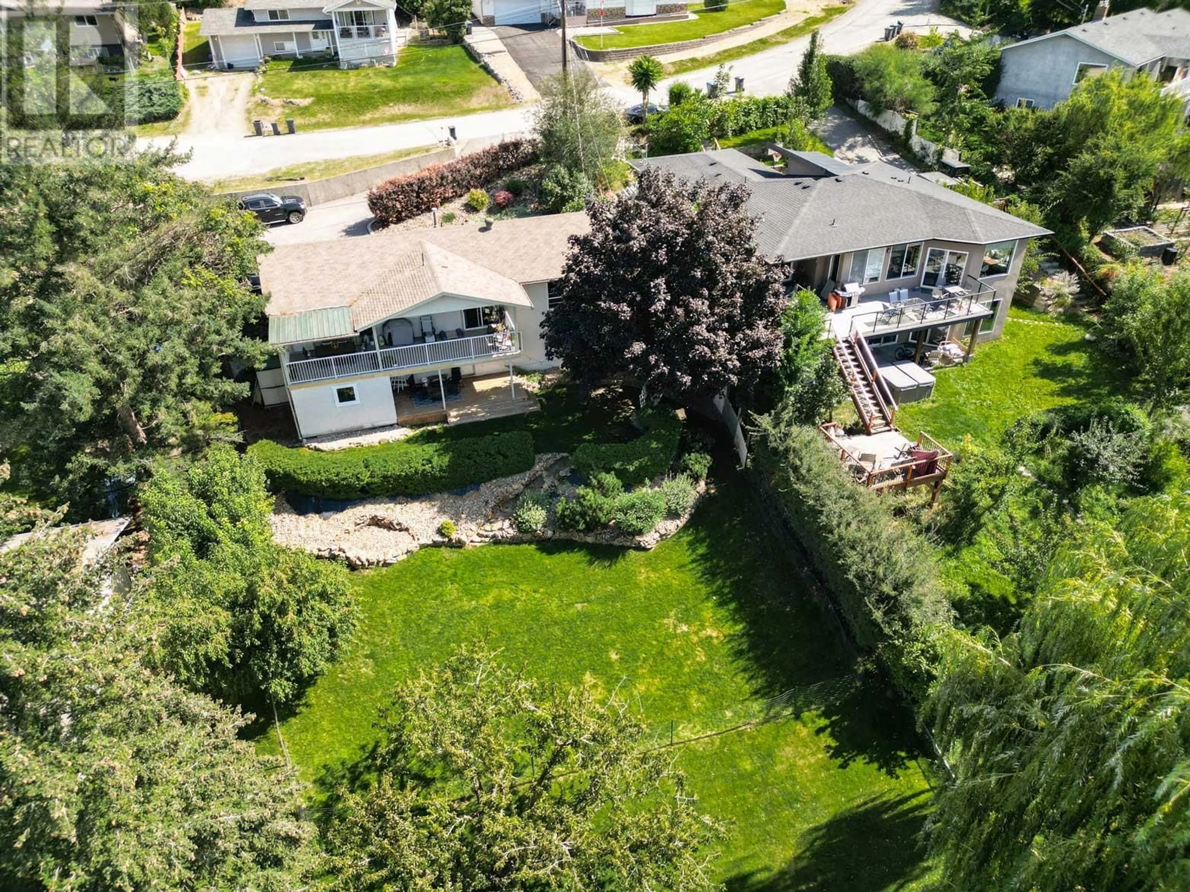 Frontside or backside of a home, the fenced backyard for 11108 Dakota Road, Lake Country British Columbia V4V1X1