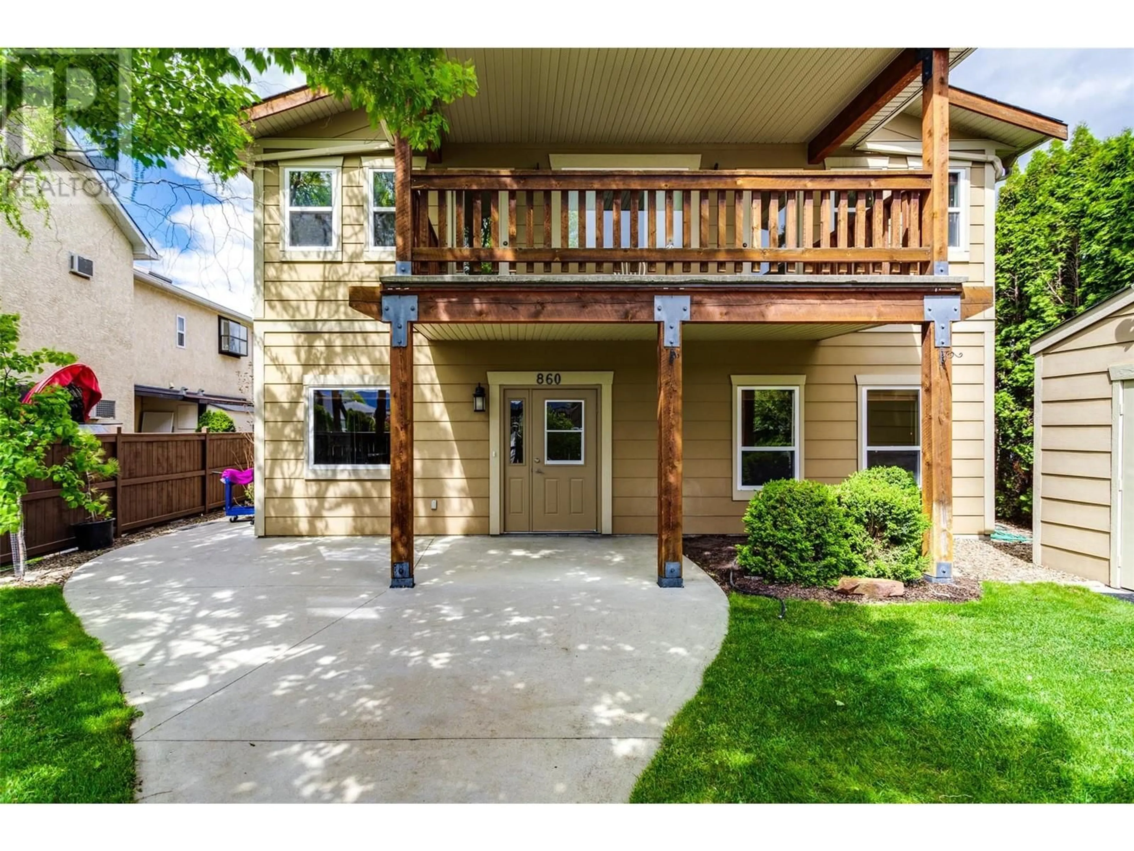 Frontside or backside of a home, the fenced backyard for 864 Glenwood Avenue, Kelowna British Columbia V1Y5M5