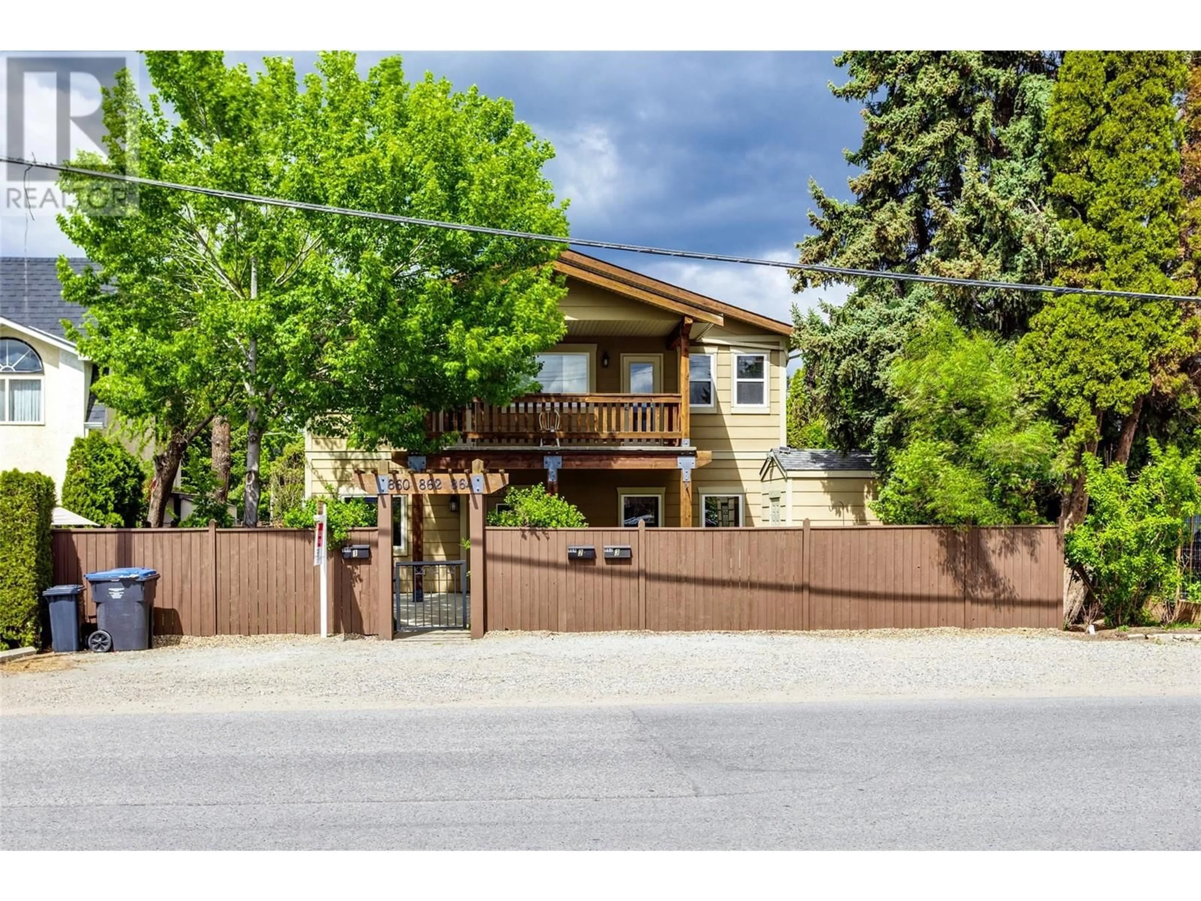 Frontside or backside of a home, the fenced backyard for 864 Glenwood Avenue, Kelowna British Columbia V1Y5M5