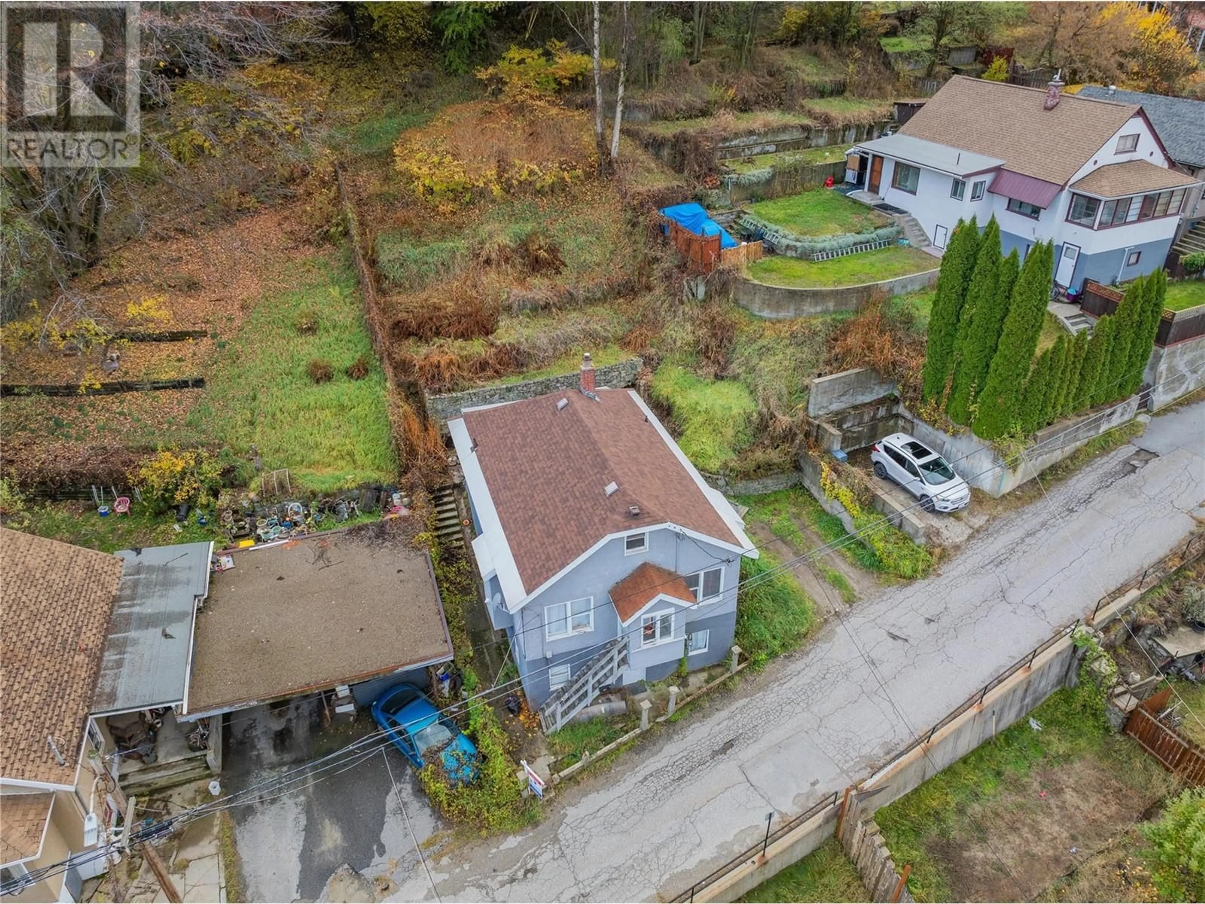 Frontside or backside of a home, the fenced backyard for 246 ESLING Street, Trail British Columbia V1R3M2