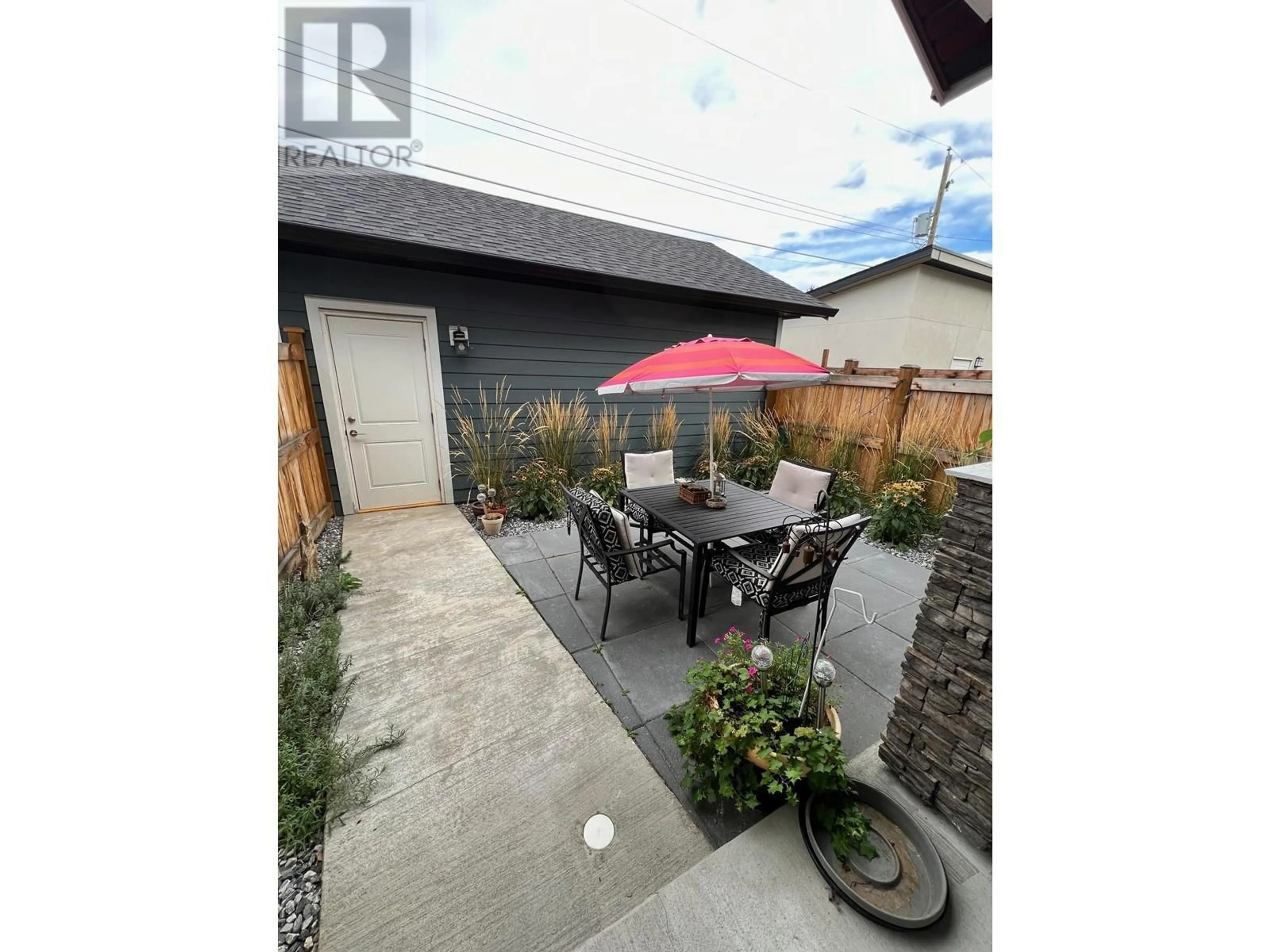 Patio, the fenced backyard for 1046 Martin Avenue Unit# 3, Kelowna British Columbia V1Y6V5