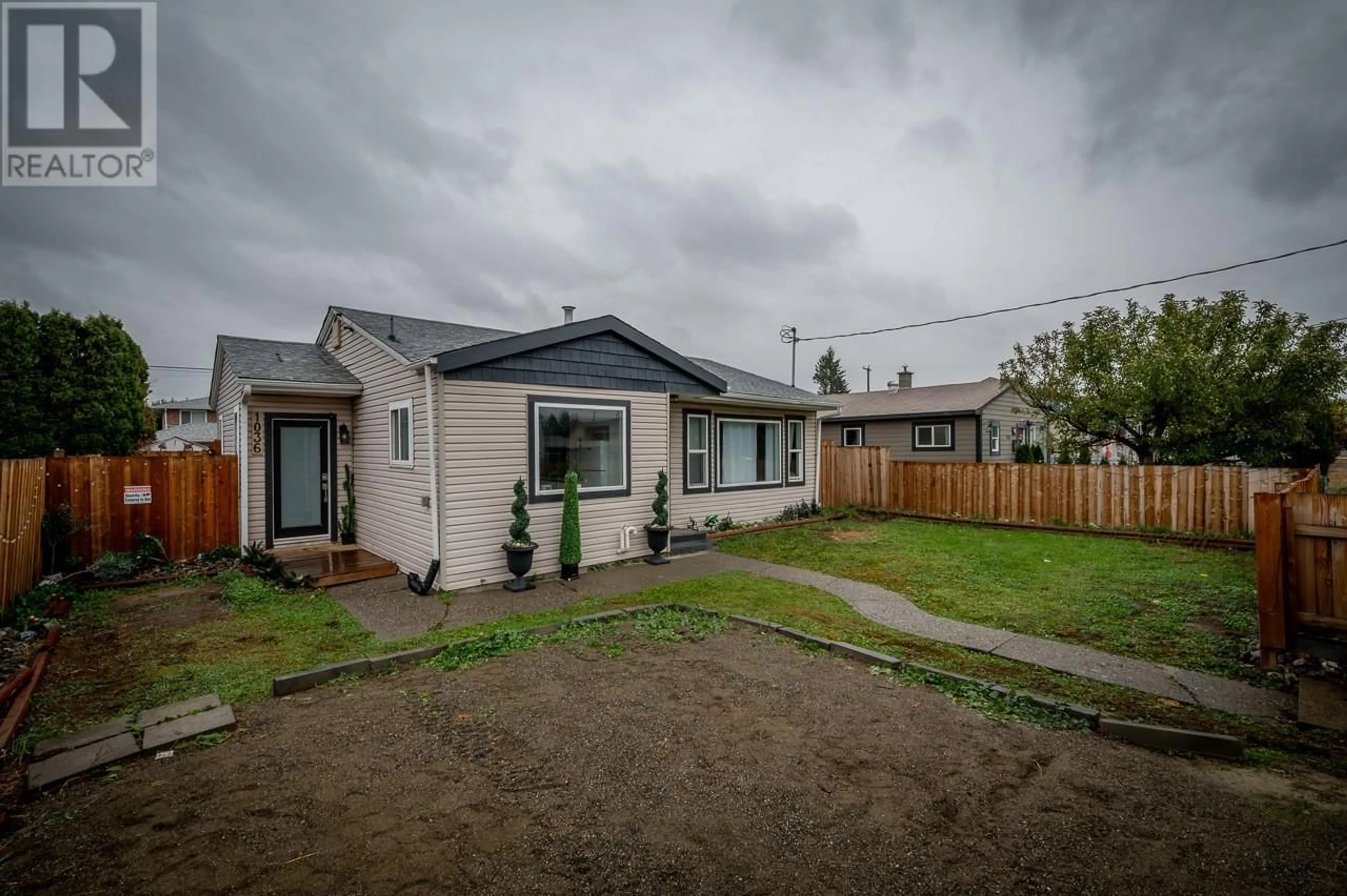 Frontside or backside of a home, the fenced backyard for 1036 SURREY Avenue, Kamloops British Columbia V2B1R3