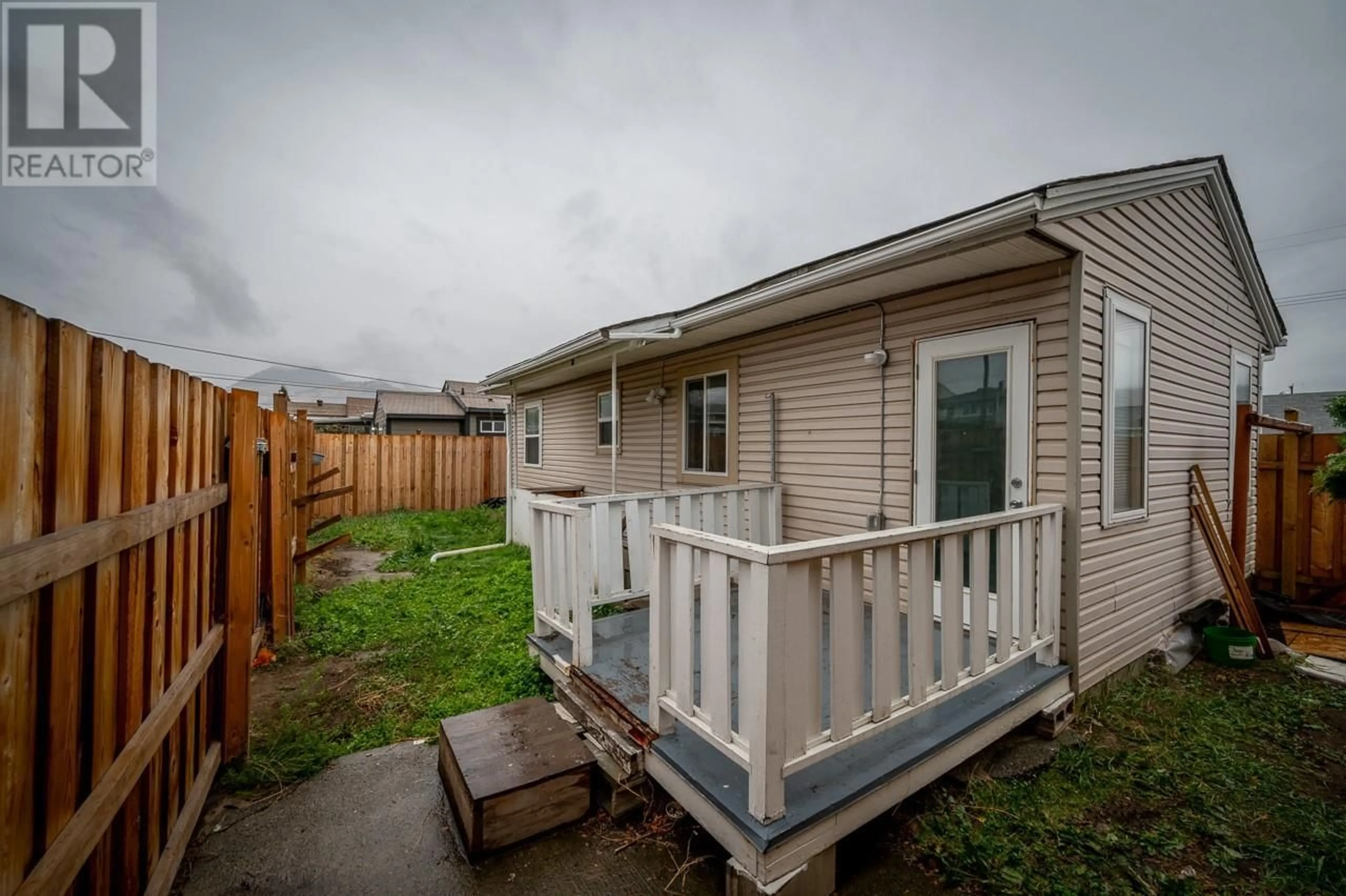 A pic from exterior of the house or condo, the fenced backyard for 1036 SURREY Avenue, Kamloops British Columbia V2B1R3