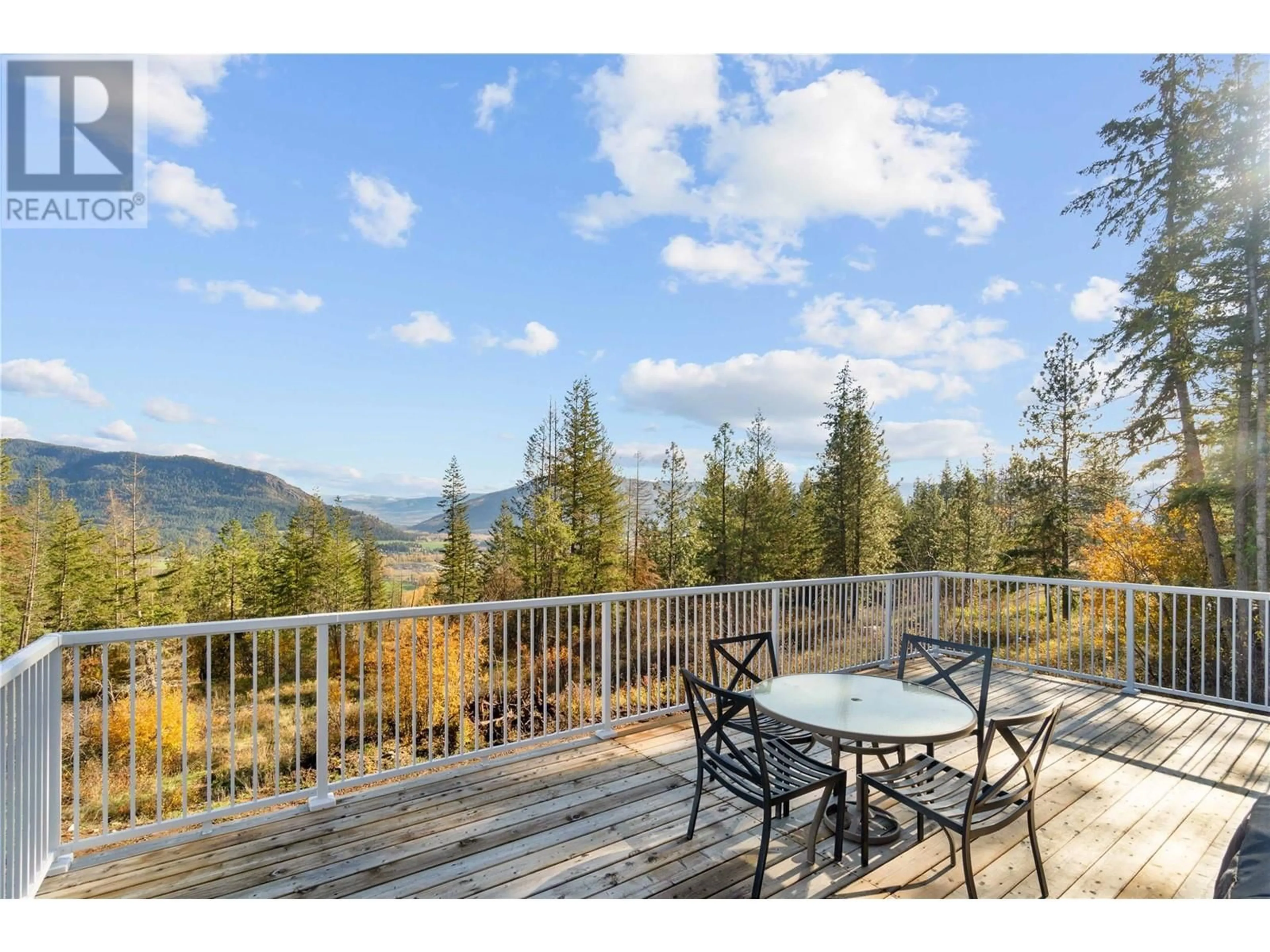 Patio, the fenced backyard for 195 Twin Lakes Road, Enderby British Columbia V0E1V3