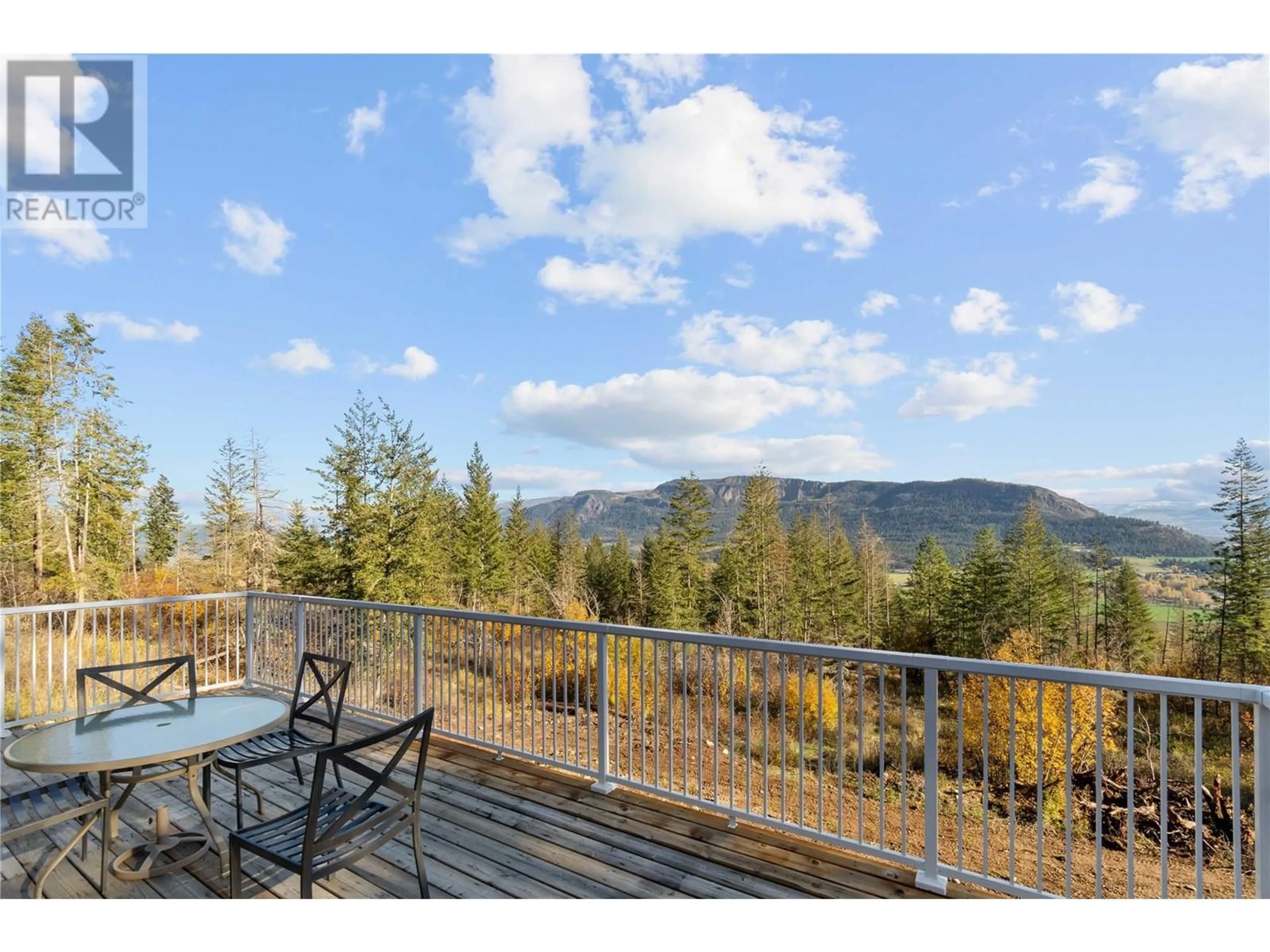 Patio, the fenced backyard for 195 Twin Lakes Road, Enderby British Columbia V0E1V3