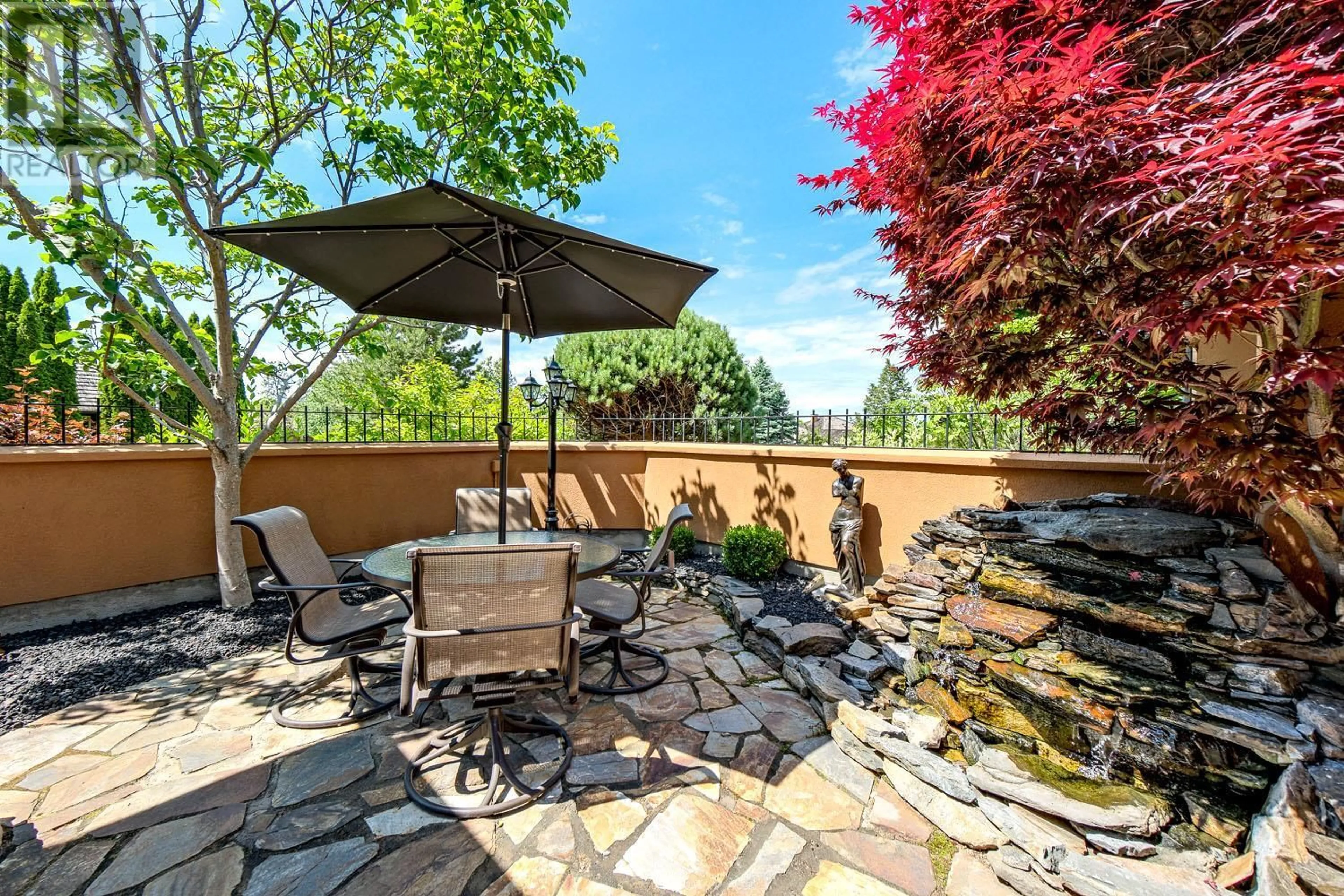 Patio, the fenced backyard for 4100 Gallaghers Parkland Drive Unit# 18, Kelowna British Columbia V1W3Z8