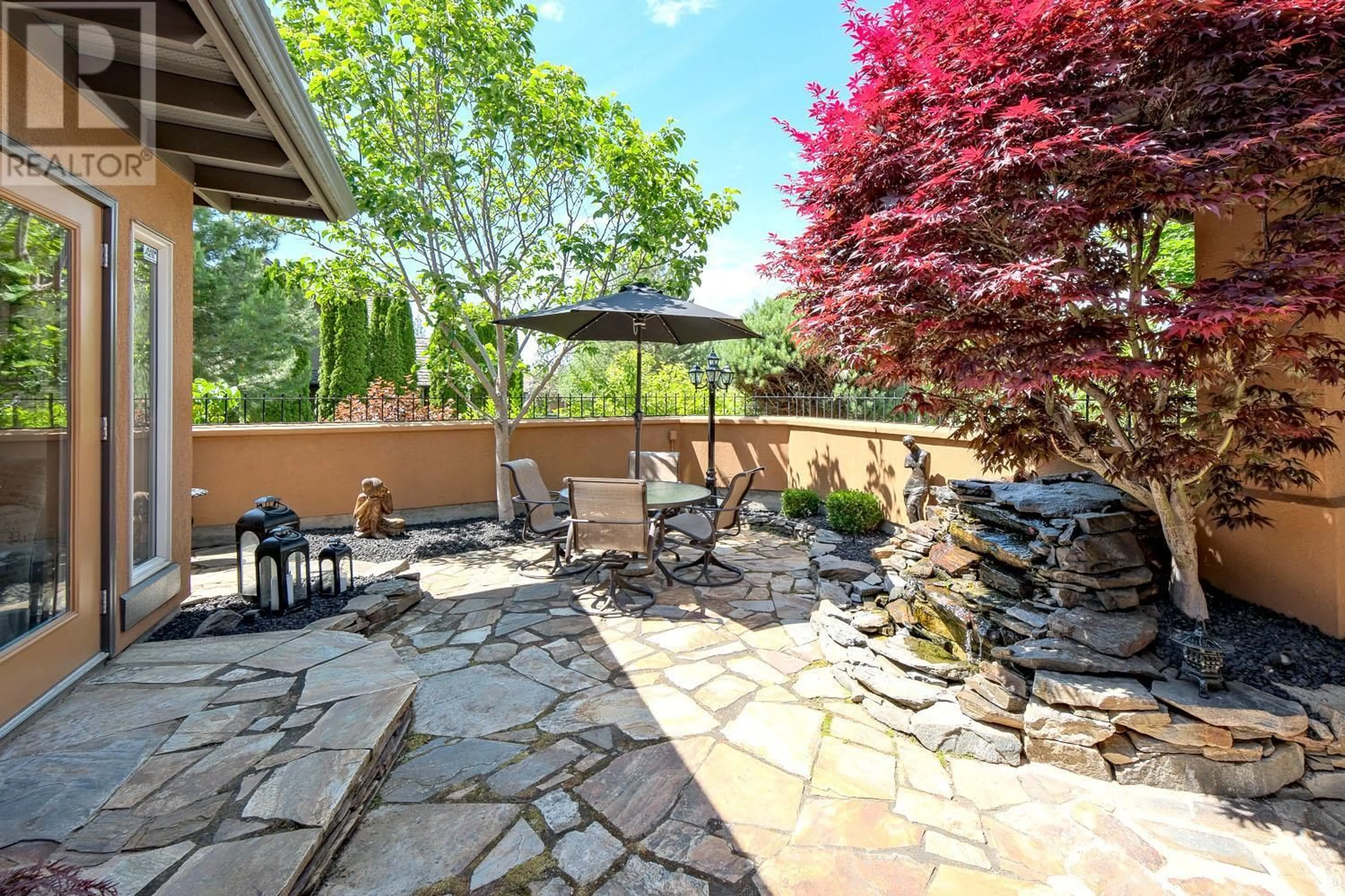 Patio, the fenced backyard for 4100 Gallaghers Parkland Drive Unit# 18, Kelowna British Columbia V1W3Z8