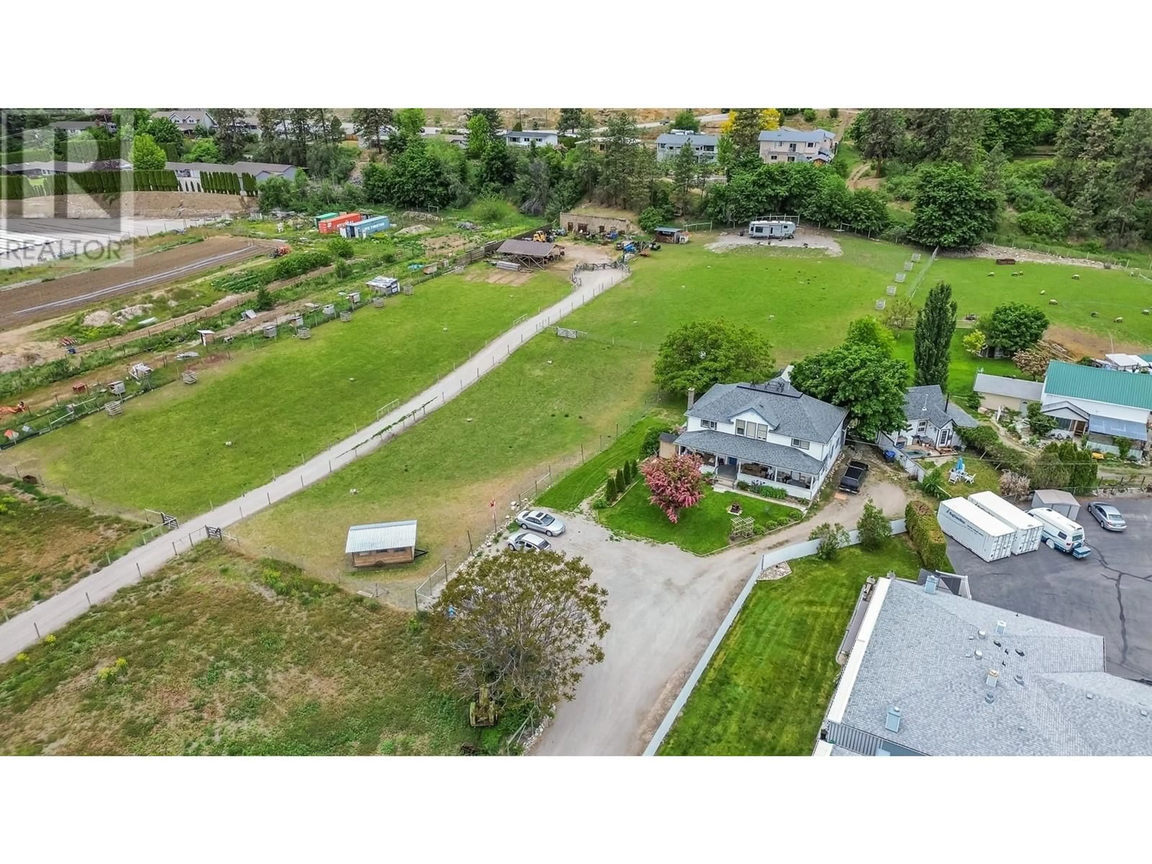 A pic from exterior of the house or condo, the fenced backyard for 14612 Garnet Avenue, Summerland British Columbia V0H1Z0