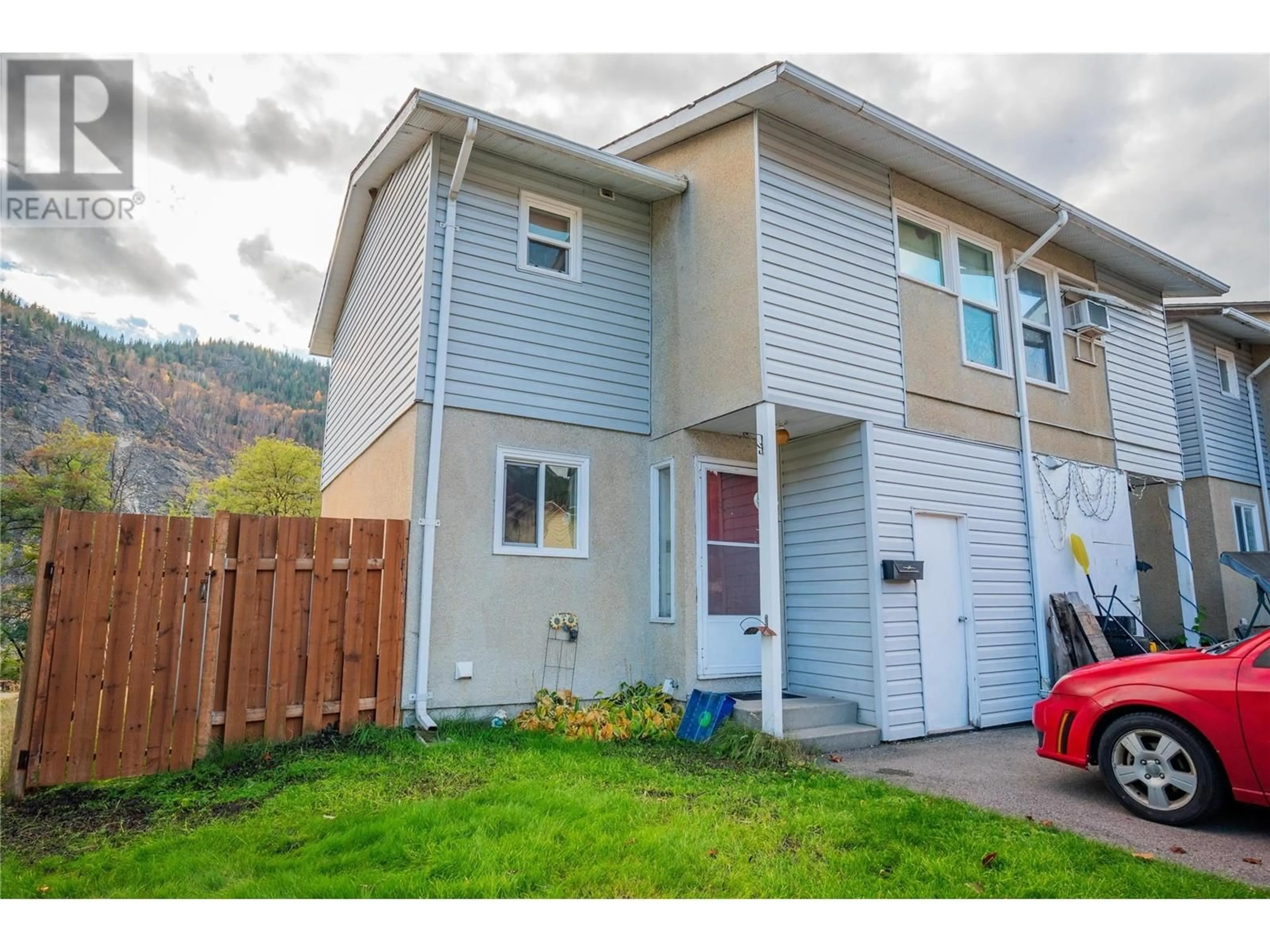 A pic from exterior of the house or condo, the fenced backyard for 3362 Laurel Crescent, Trail British Columbia V1R4M5