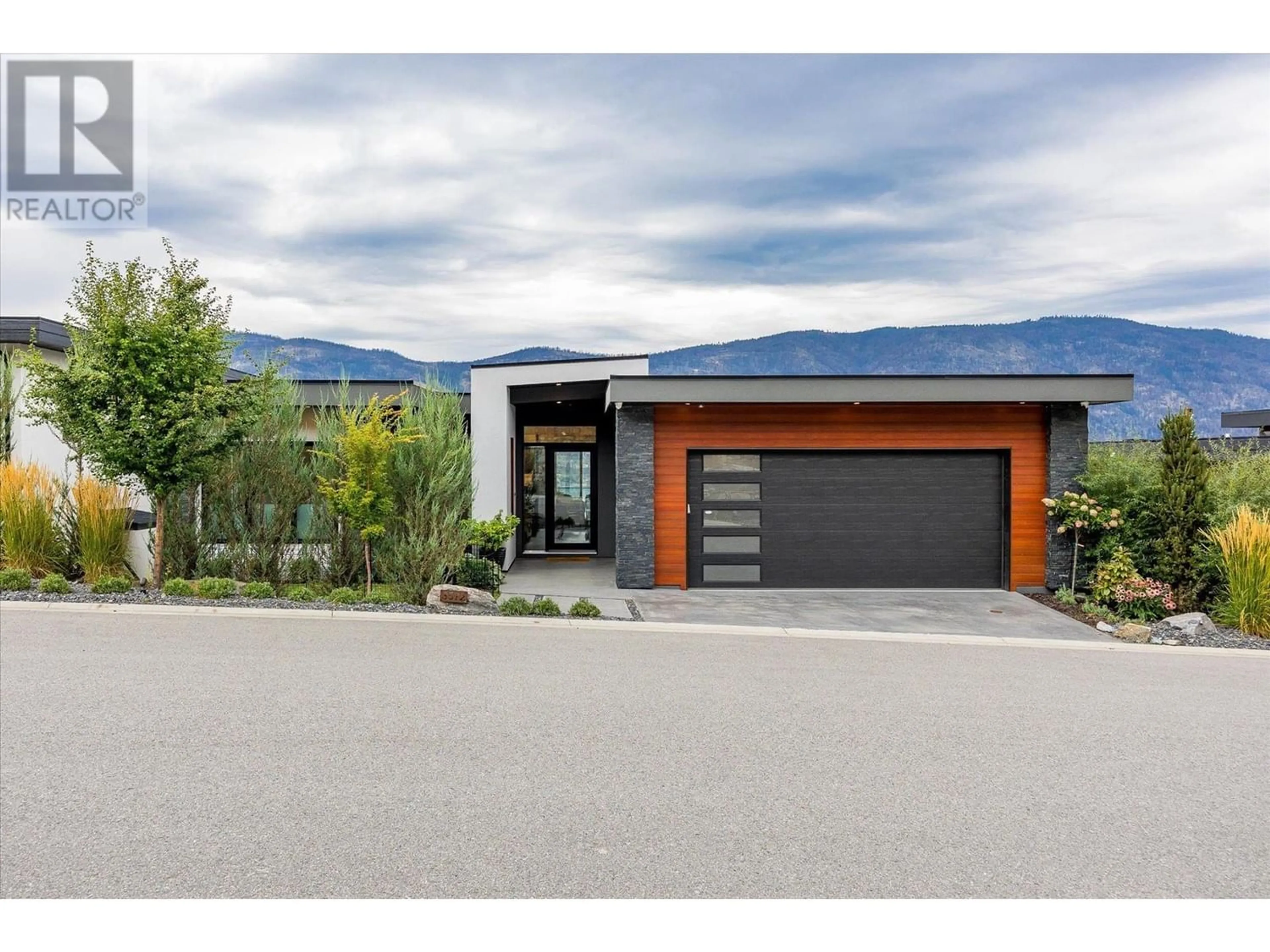 Frontside or backside of a home, the street view for 3572 Wild Rose Road, Kelowna British Columbia V1V3G1