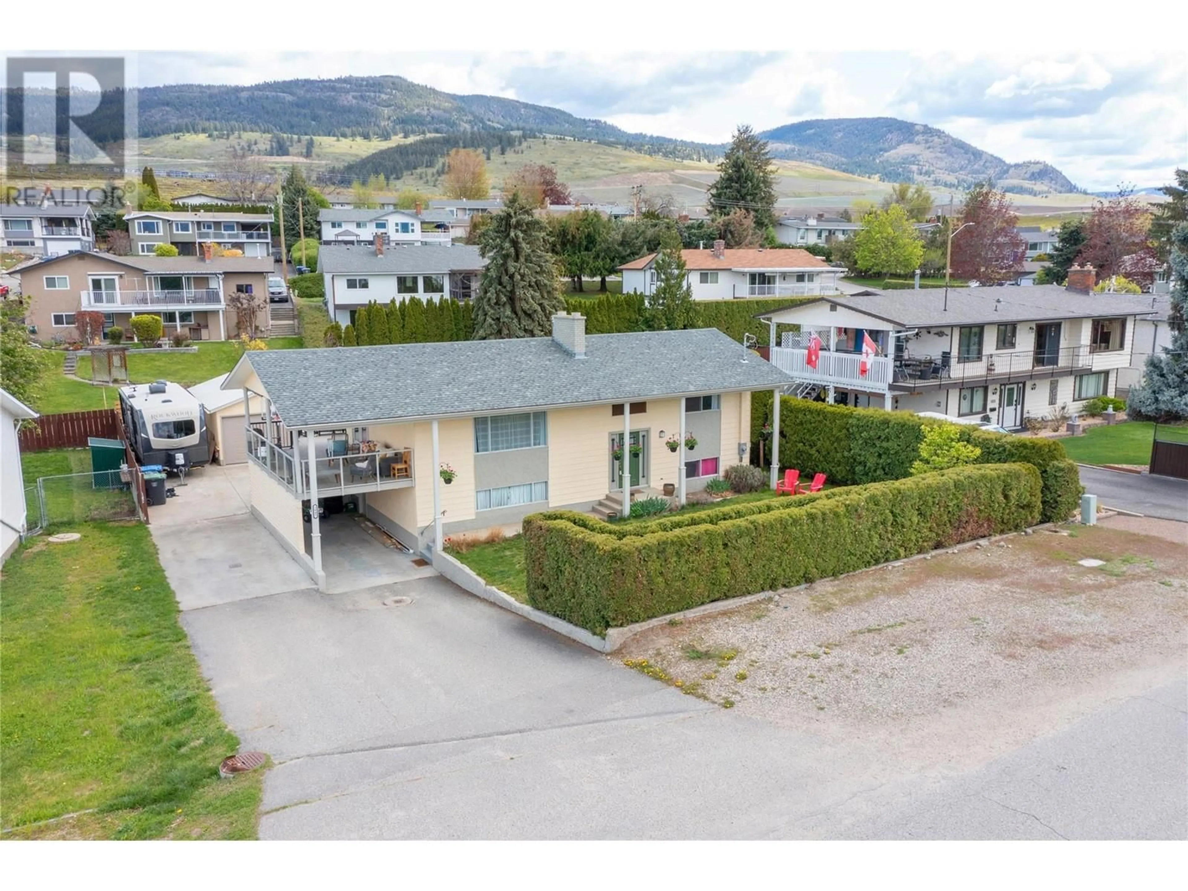 A pic from exterior of the house or condo, the street view for 1845 Hayashi Road, Kelowna British Columbia V1P1A7