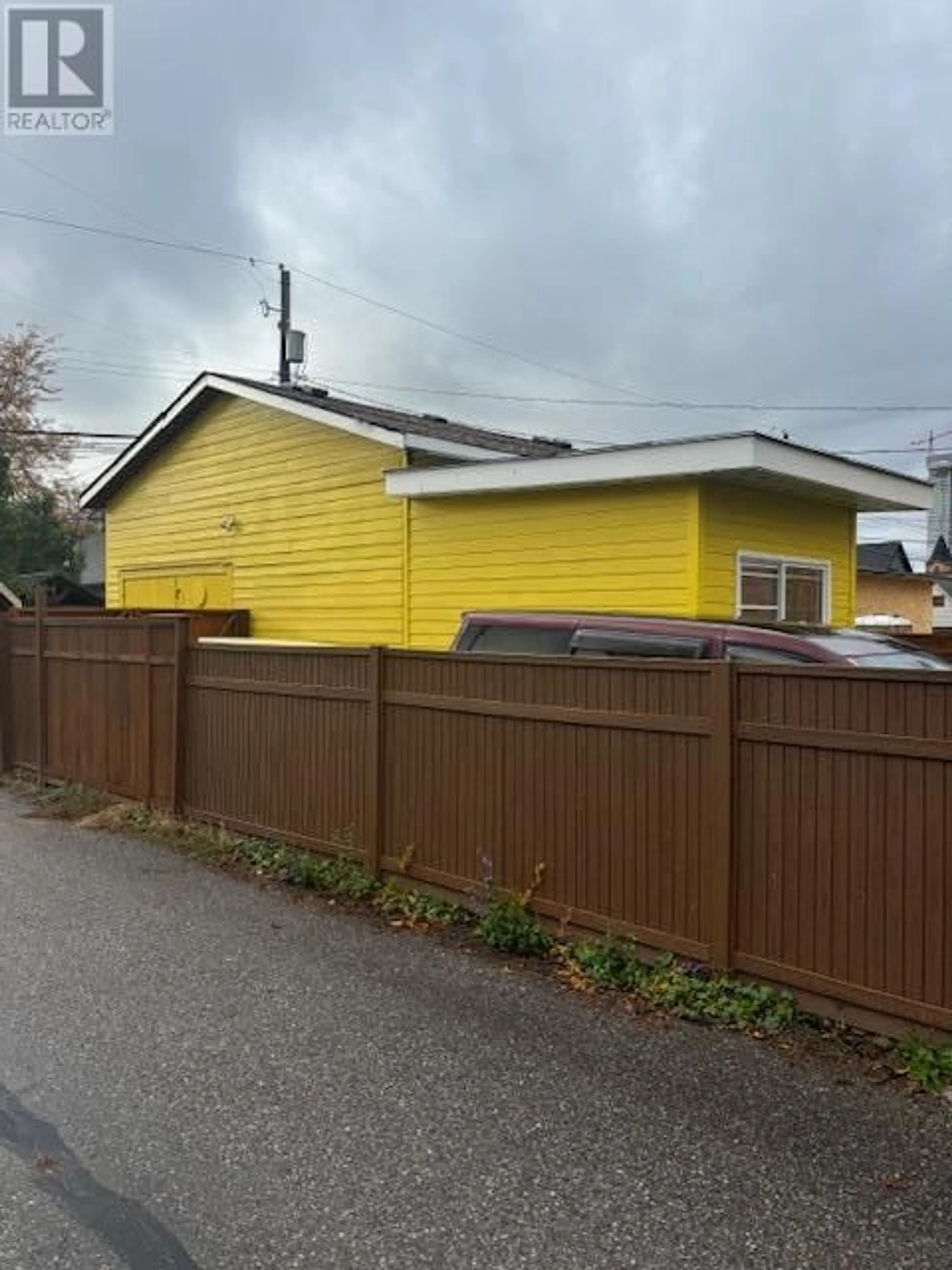 Frontside or backside of a home, the fenced backyard for 795 Lawson Avenue, Kelowna British Columbia V1Y6S9