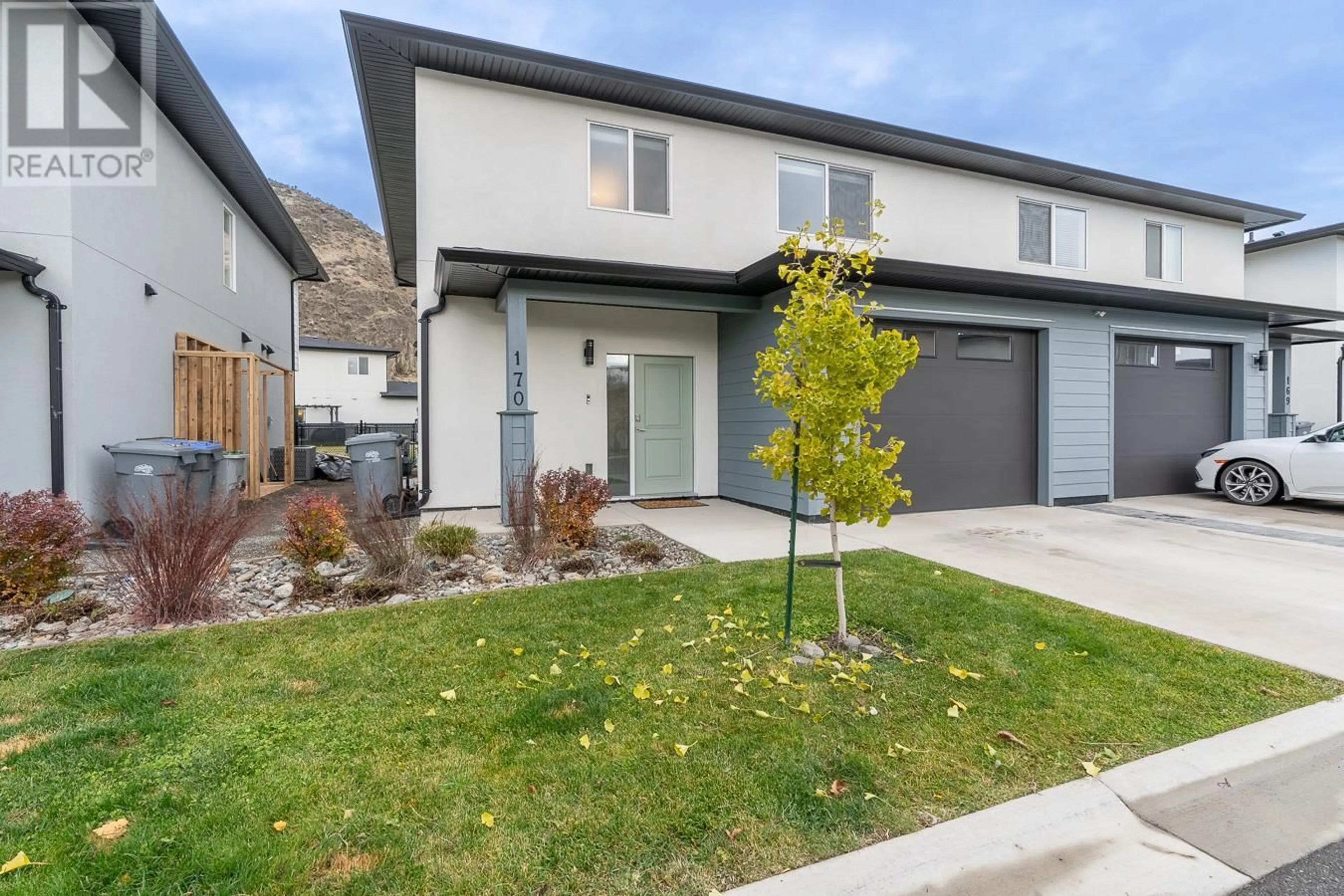 Frontside or backside of a home, the fenced backyard for 2683 ORD Road Unit# 170, Kamloops British Columbia V2B0J2