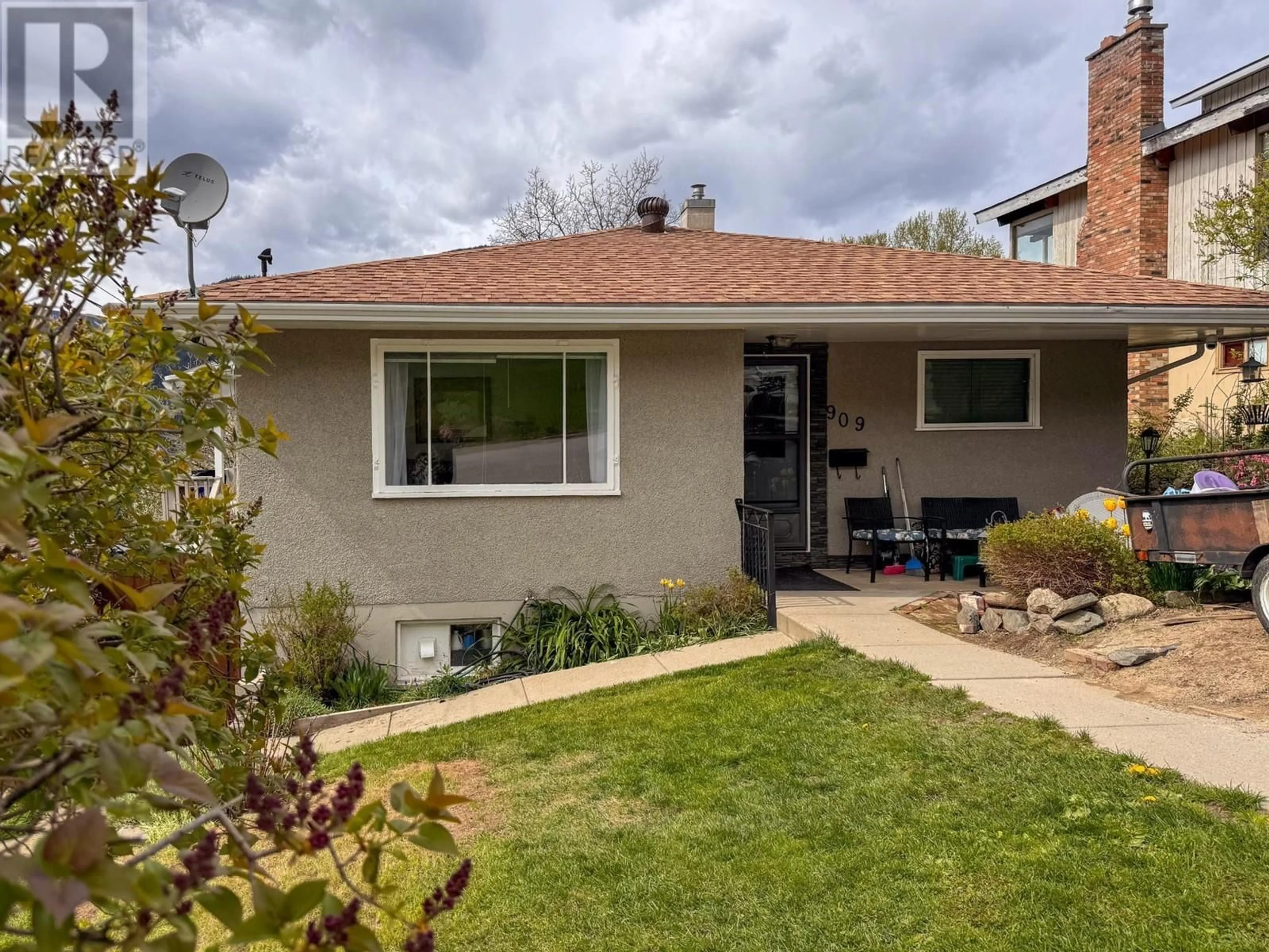 Frontside or backside of a home, the fenced backyard for 909 INNES Street, Nelson British Columbia V1L5G7