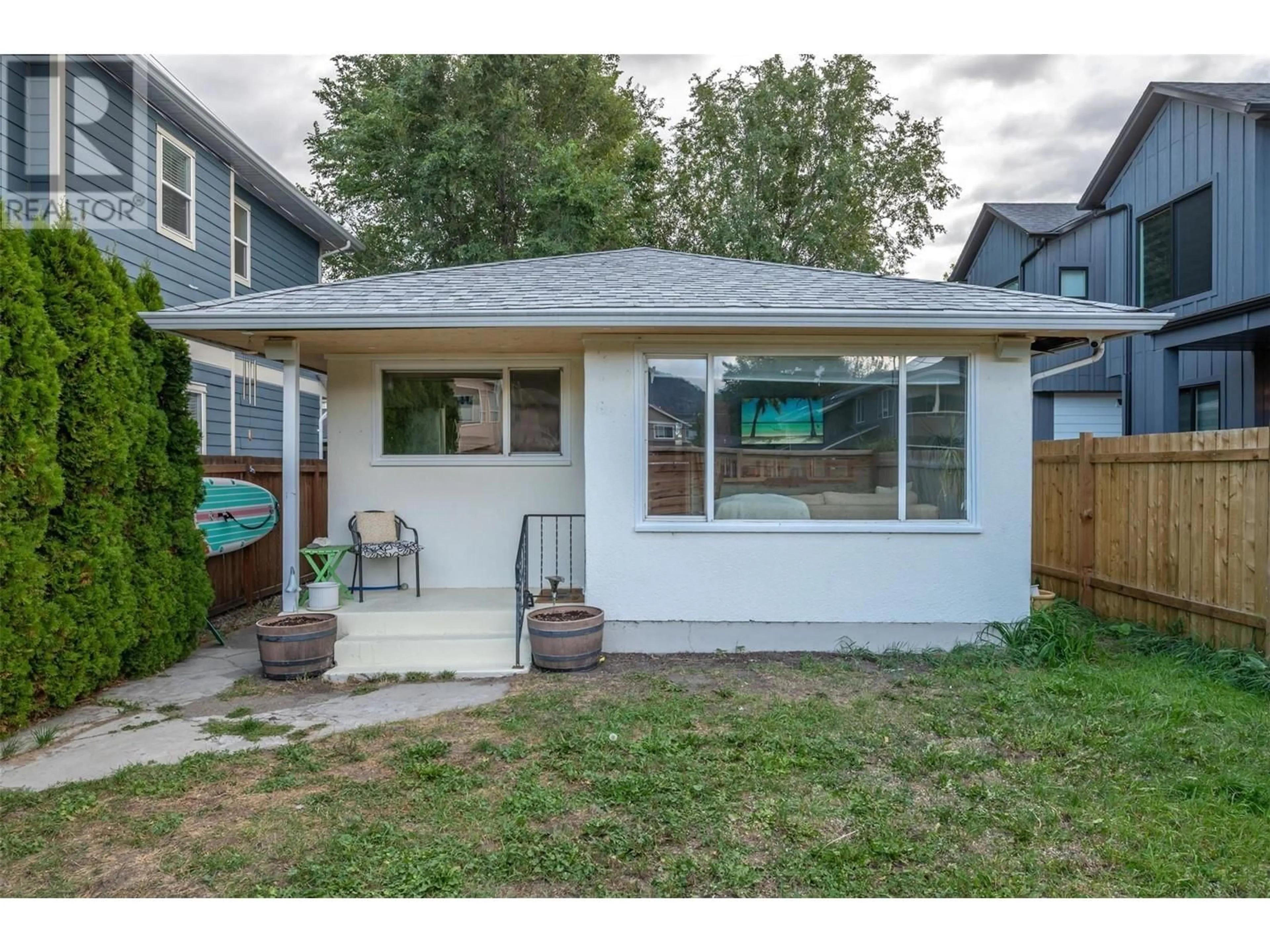 Frontside or backside of a home, the fenced backyard for 282 Bassett Avenue, Penticton British Columbia V2A5W3