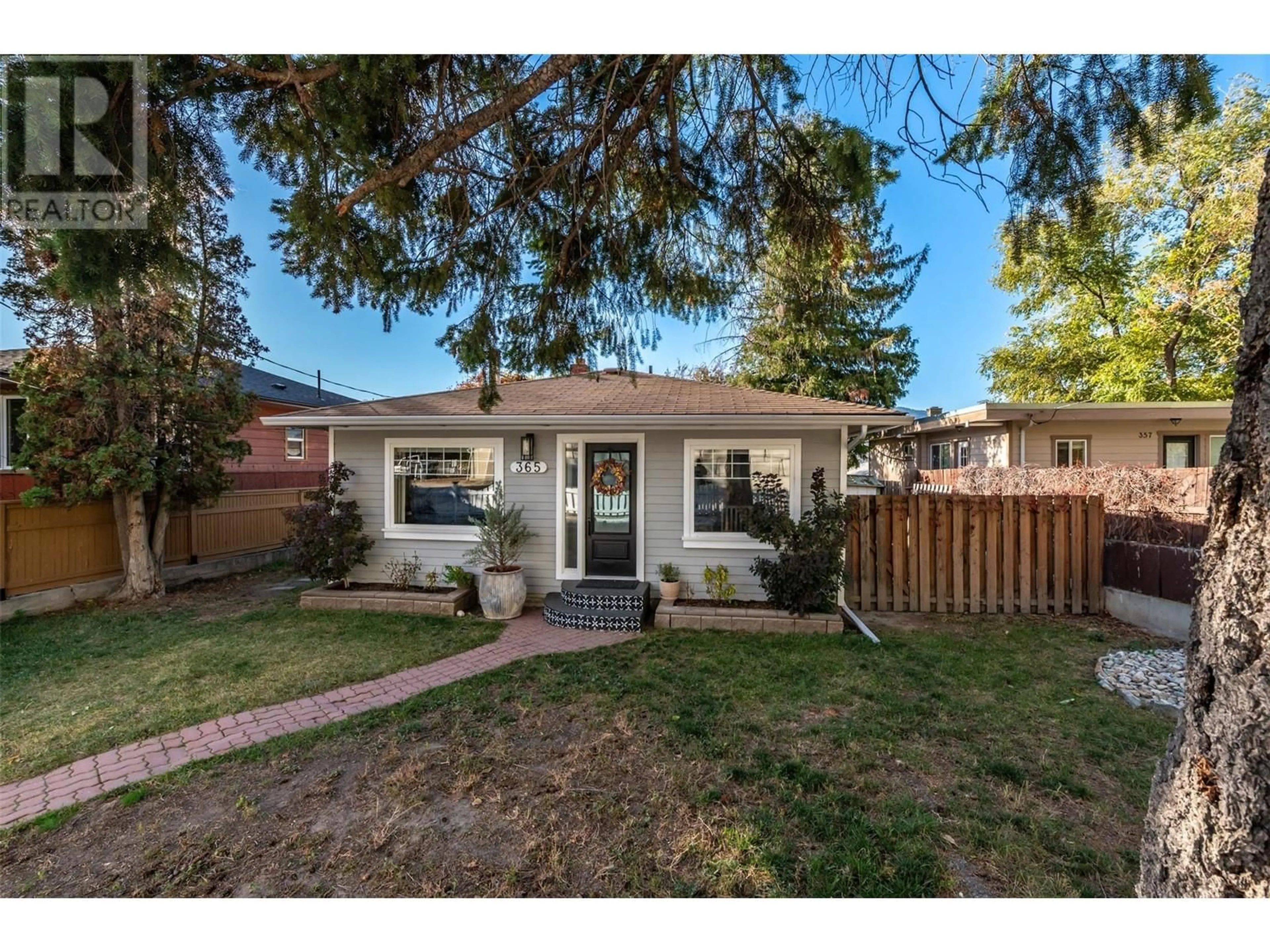 Frontside or backside of a home, the fenced backyard for 365 Townley Street, Penticton British Columbia V2A4H5