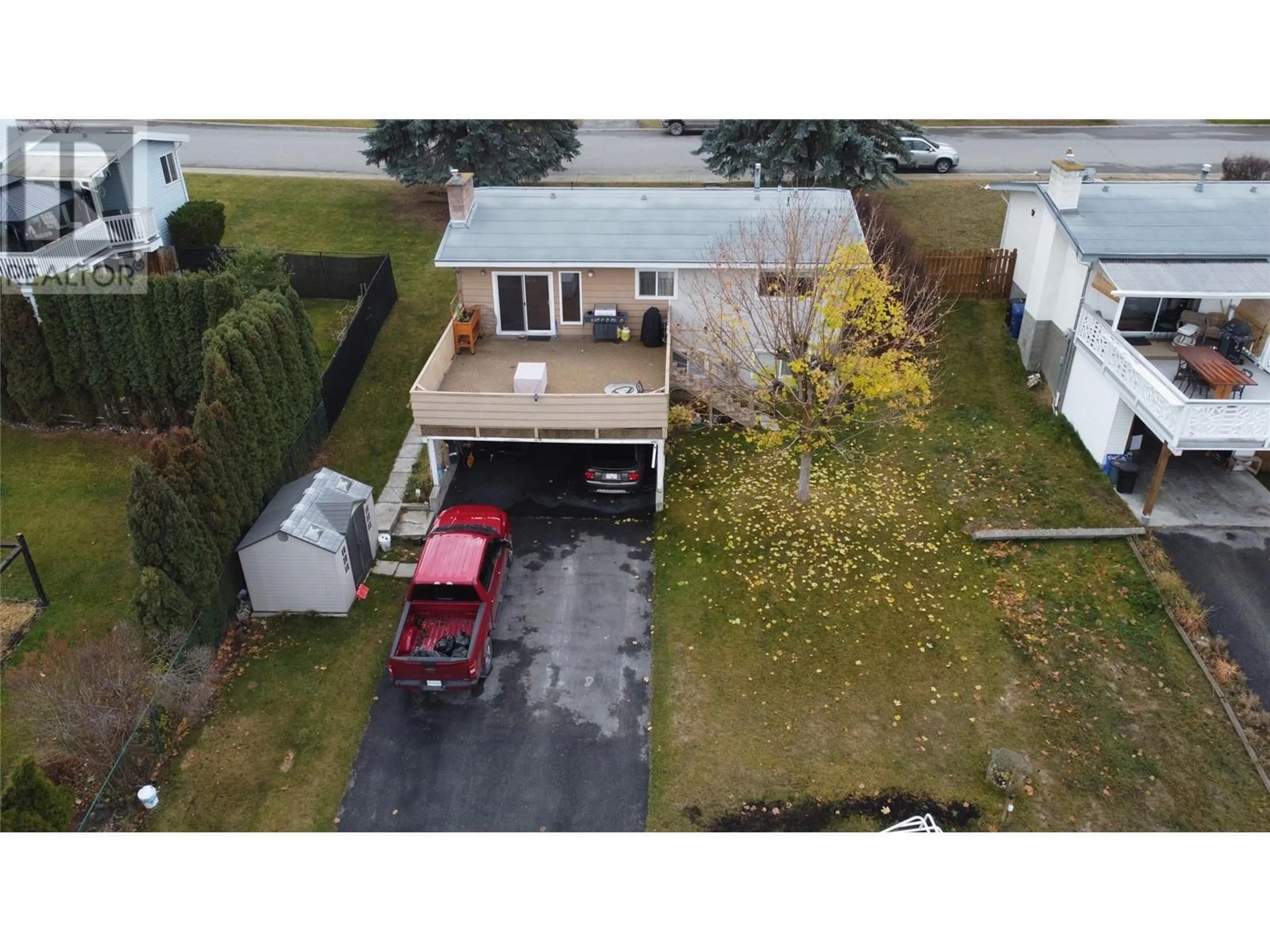 Frontside or backside of a home, the fenced backyard for 828 14TH  S Street, Cranbrook British Columbia V1C1X9