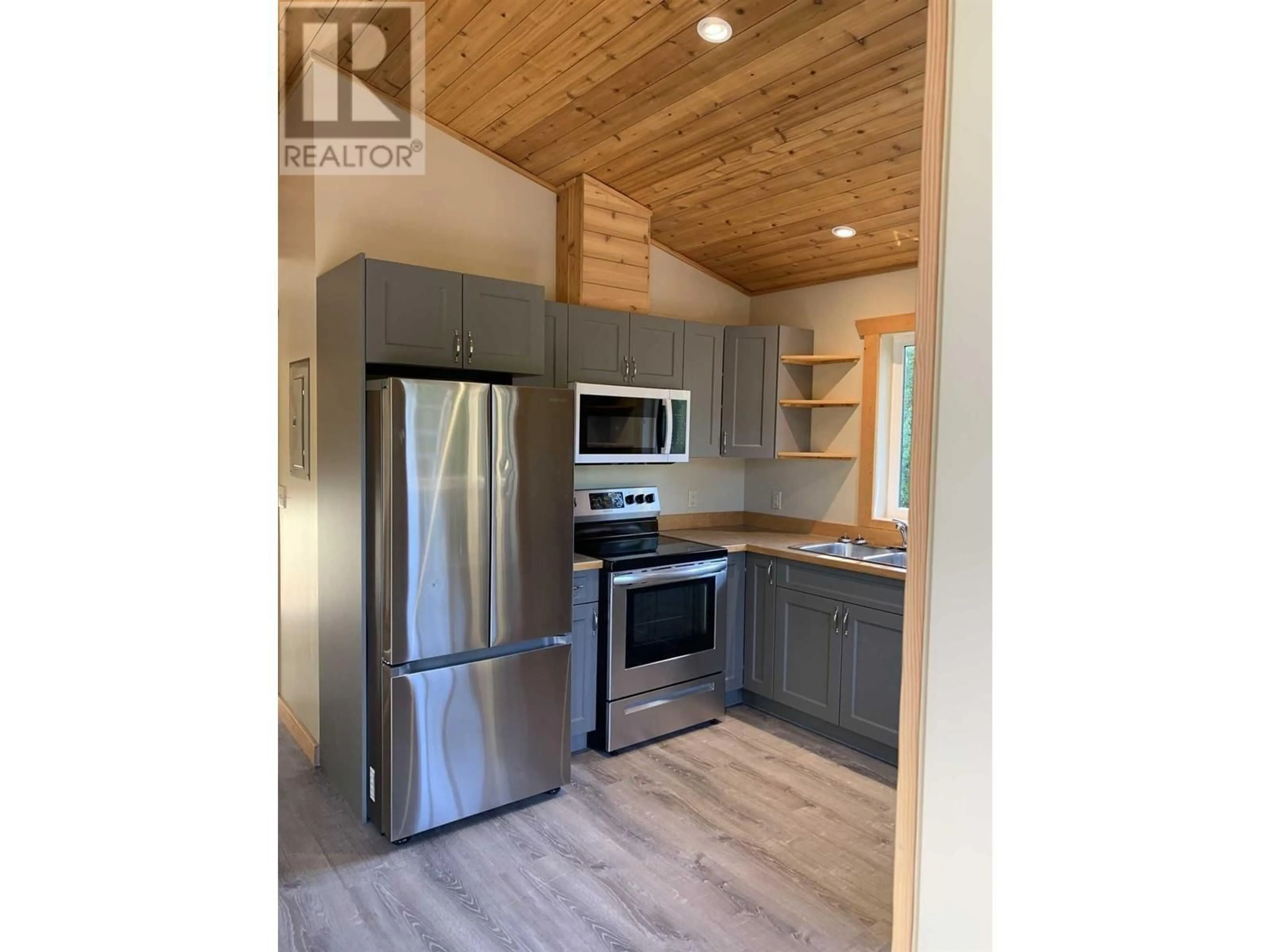Open concept kitchen, wood/laminate floor for 5525 DUCKSWAY ROAD, Winlaw British Columbia V0G2J0