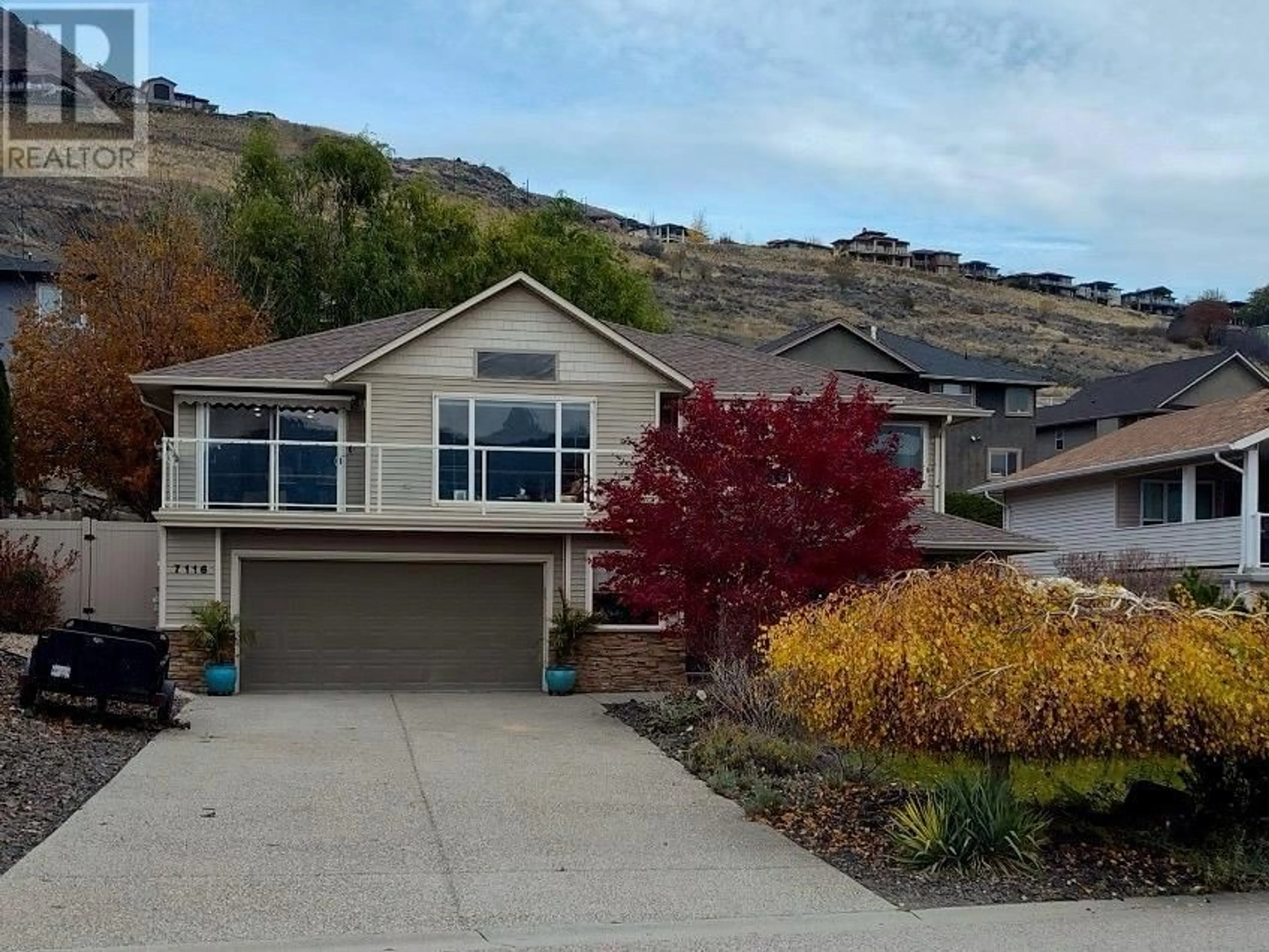 Frontside or backside of a home, the street view for 7116 Lakeridge Drive, Vernon British Columbia V1H1Y2