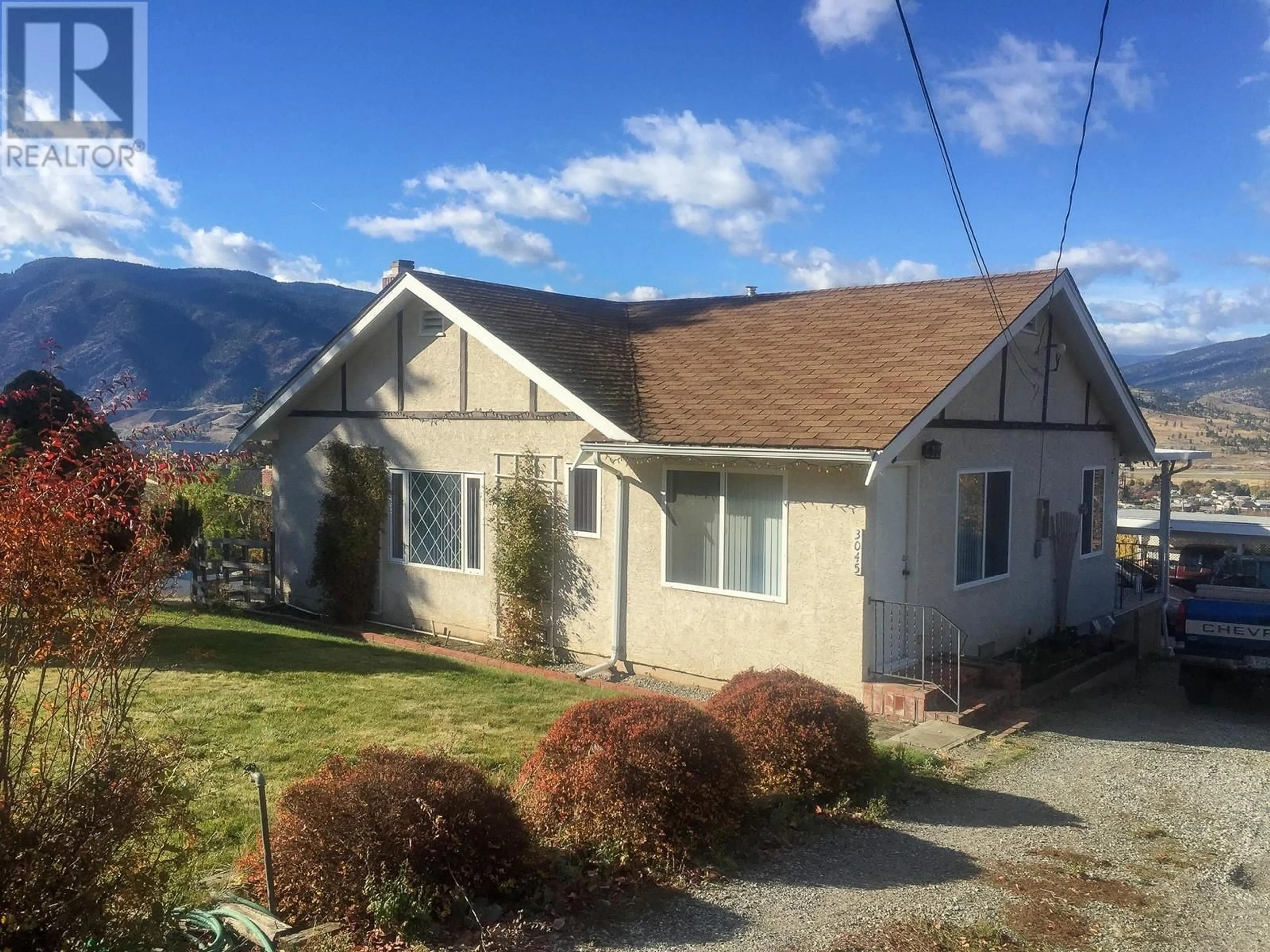 A pic from outside/outdoor area/front of a property/back of a property/a pic from drone, mountain view for 3045 VALLEYVIEW ROAD, Penticton British Columbia V2A8W8