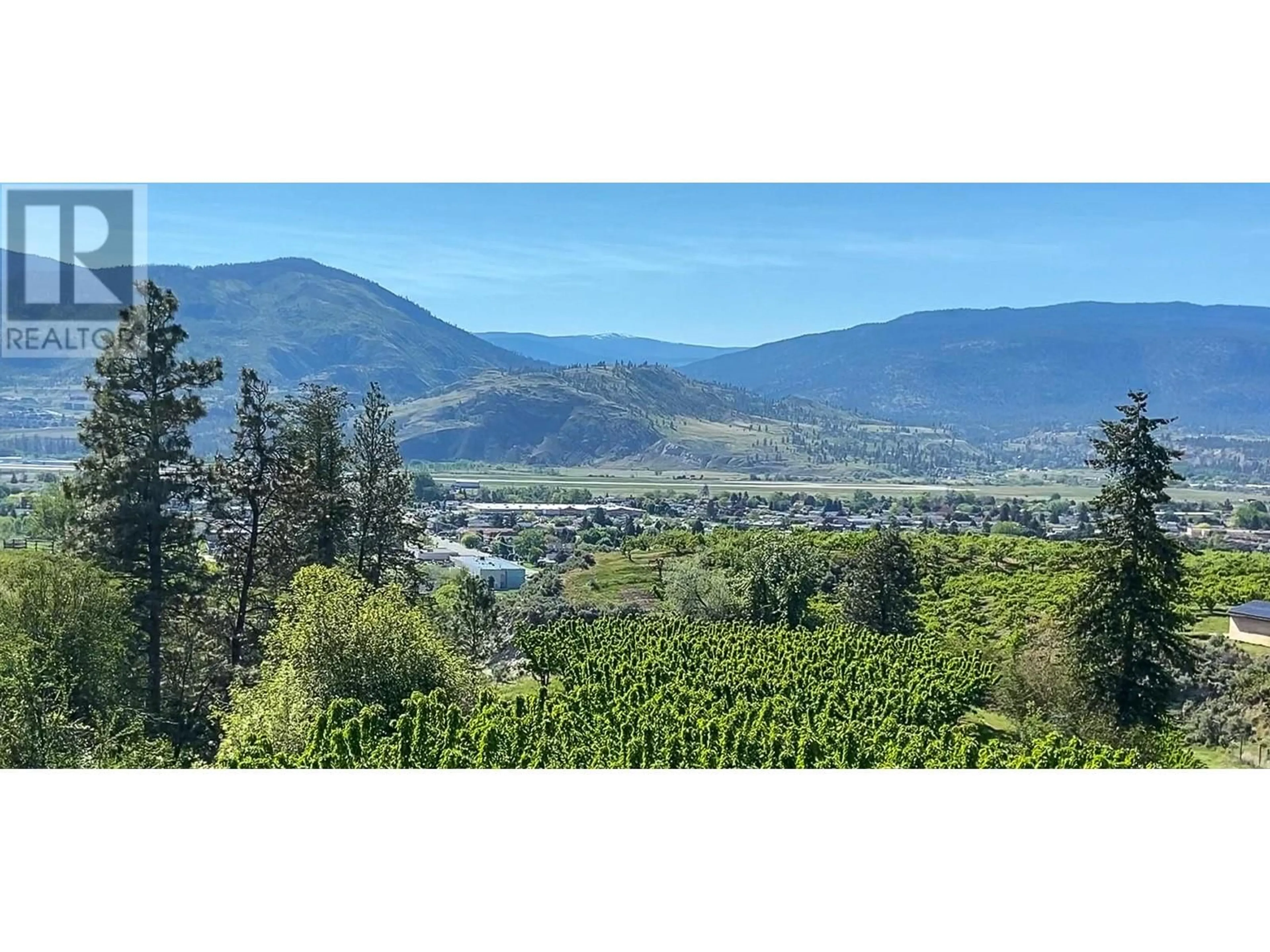 A pic from outside/outdoor area/front of a property/back of a property/a pic from drone, mountain view for 3045 VALLEYVIEW ROAD, Penticton British Columbia V2A8W8