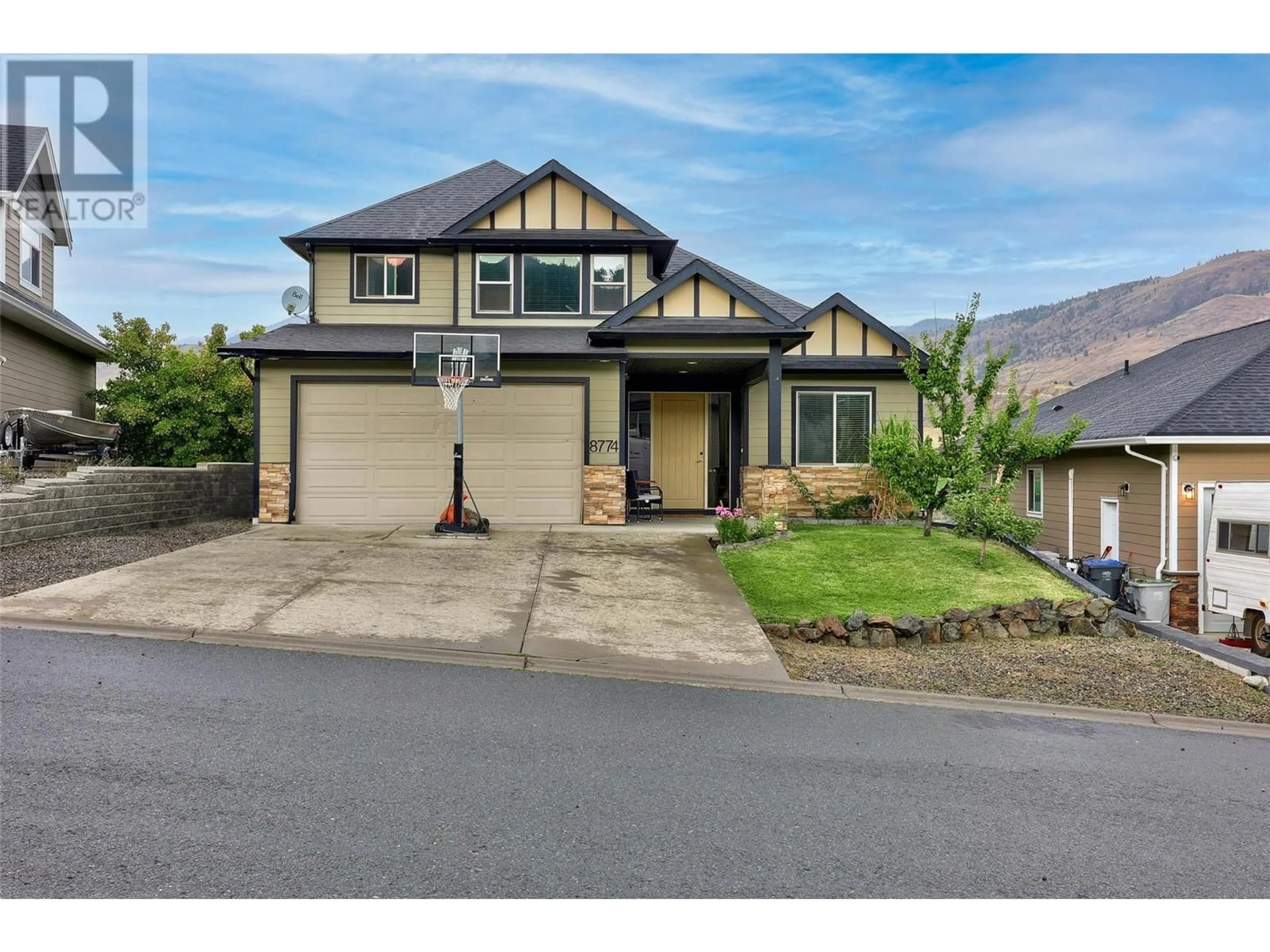 Frontside or backside of a home, the street view for 8774 BADGER Drive, Kamloops British Columbia V2H1T7