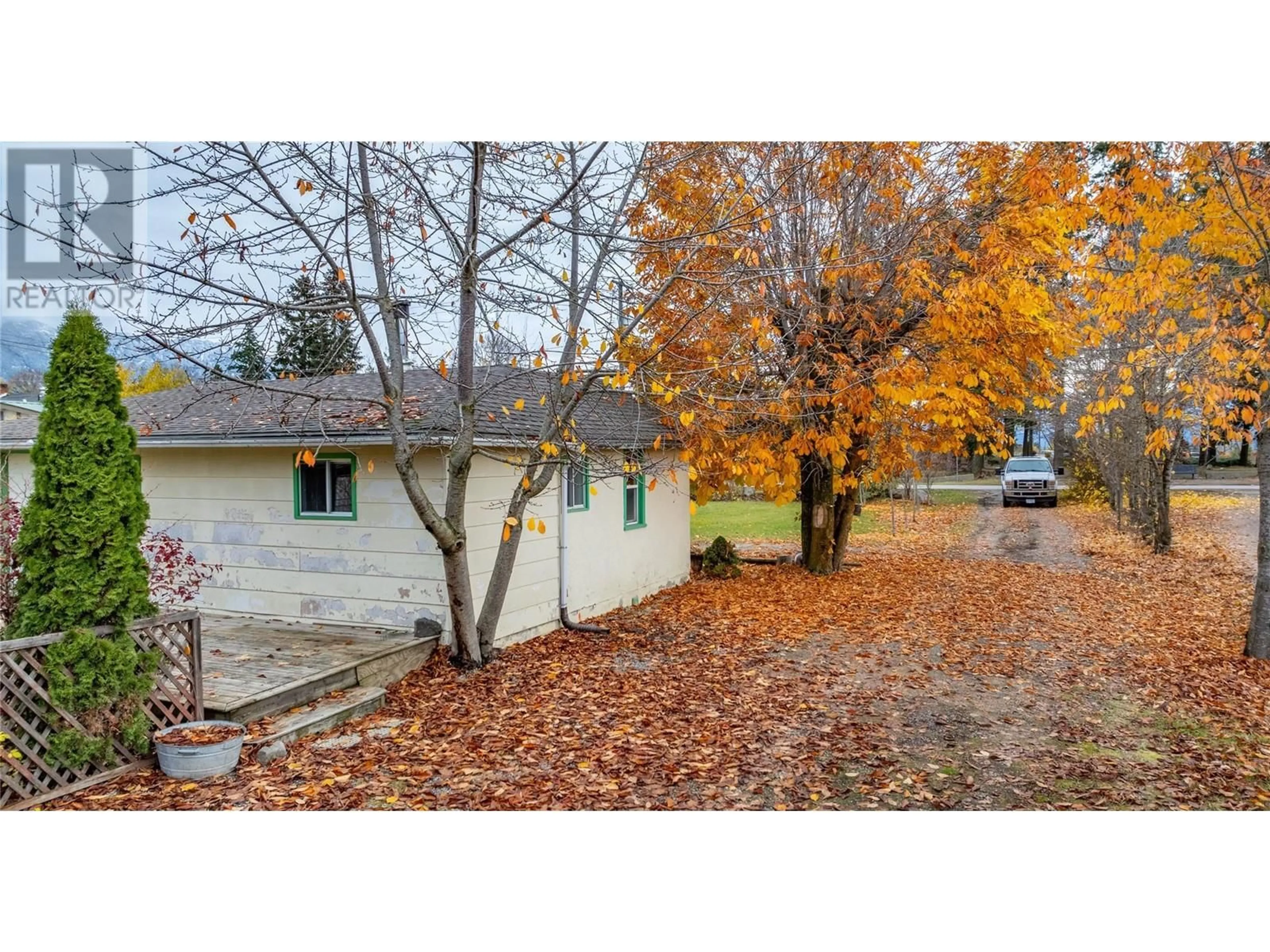 A pic from exterior of the house or condo, the fenced backyard for 518 Devon Street, Creston British Columbia V0B1G3