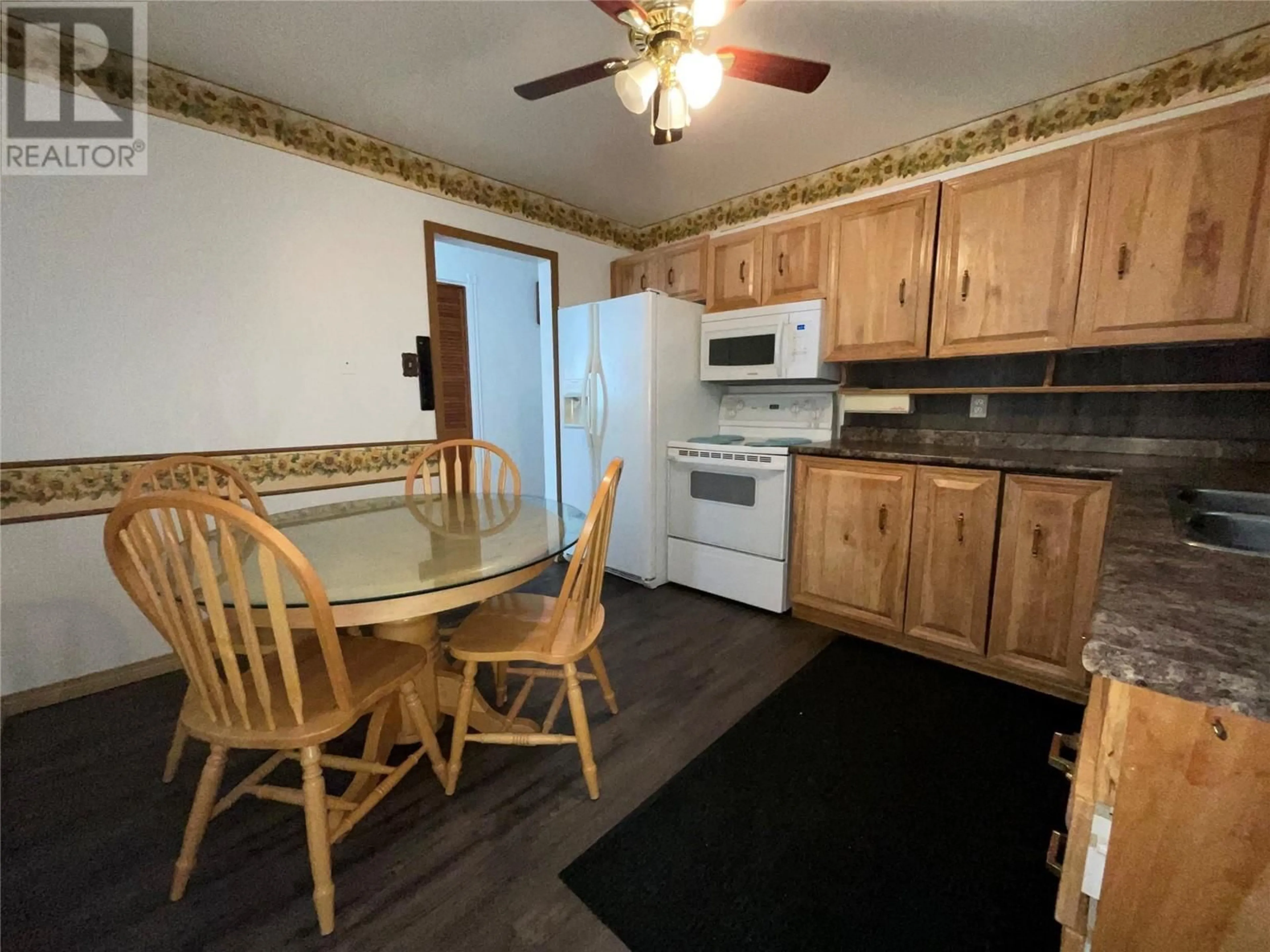 Standard kitchen, wood/laminate floor for 91 WOLVERINE AVENUE, Tumbler Ridge British Columbia V0C2W0