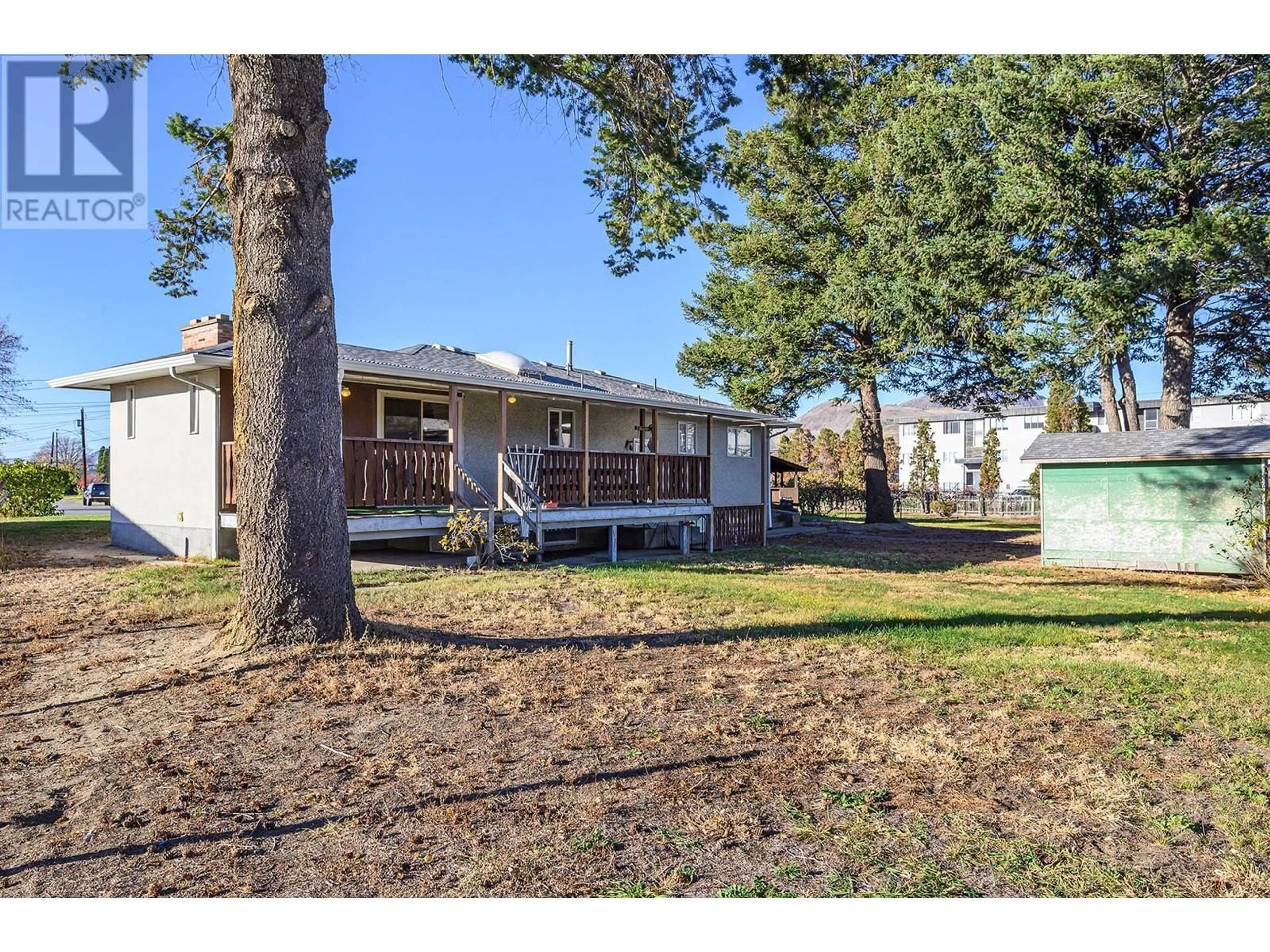 Frontside or backside of a home, the fenced backyard for 918 Kirkland Place, Kamloops British Columbia V2B3Y6