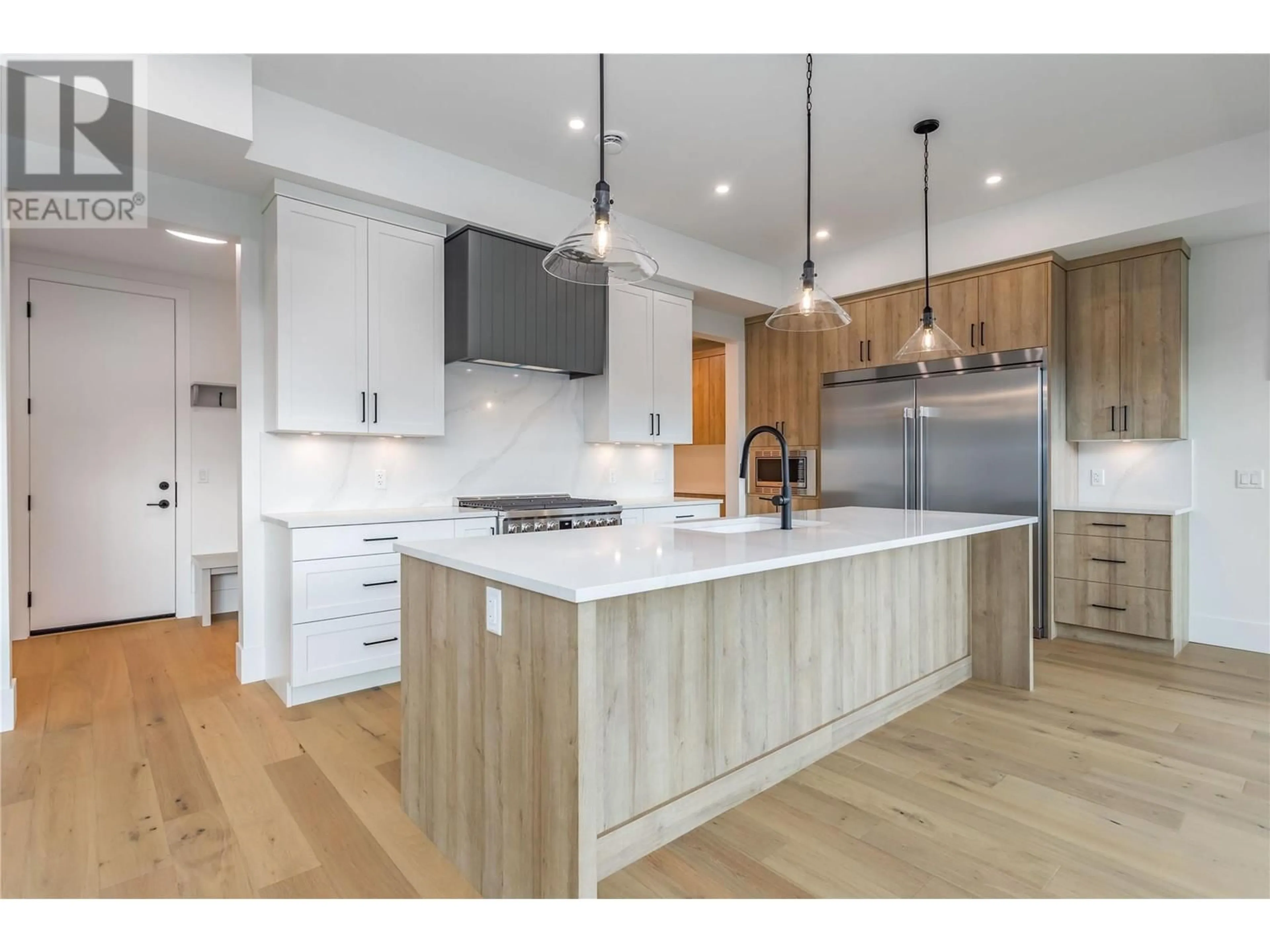 Open concept kitchen for 907 Bull Crescent Lot# 91, Kelowna British Columbia V1W0B6