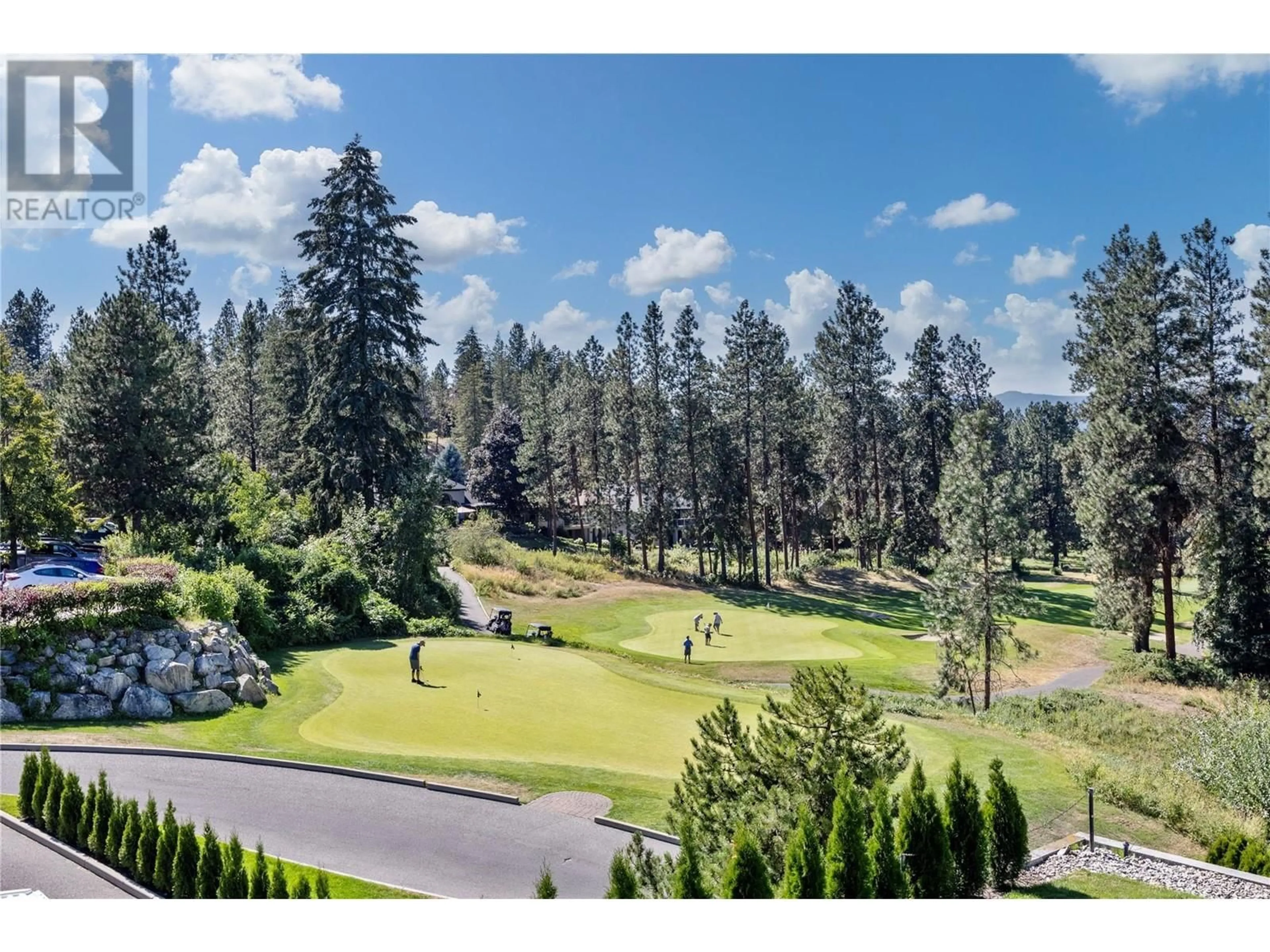 A pic from outside/outdoor area/front of a property/back of a property/a pic from drone, forest/trees view for 4141 Gallaghers Boulevard S, Kelowna British Columbia V1W4V2