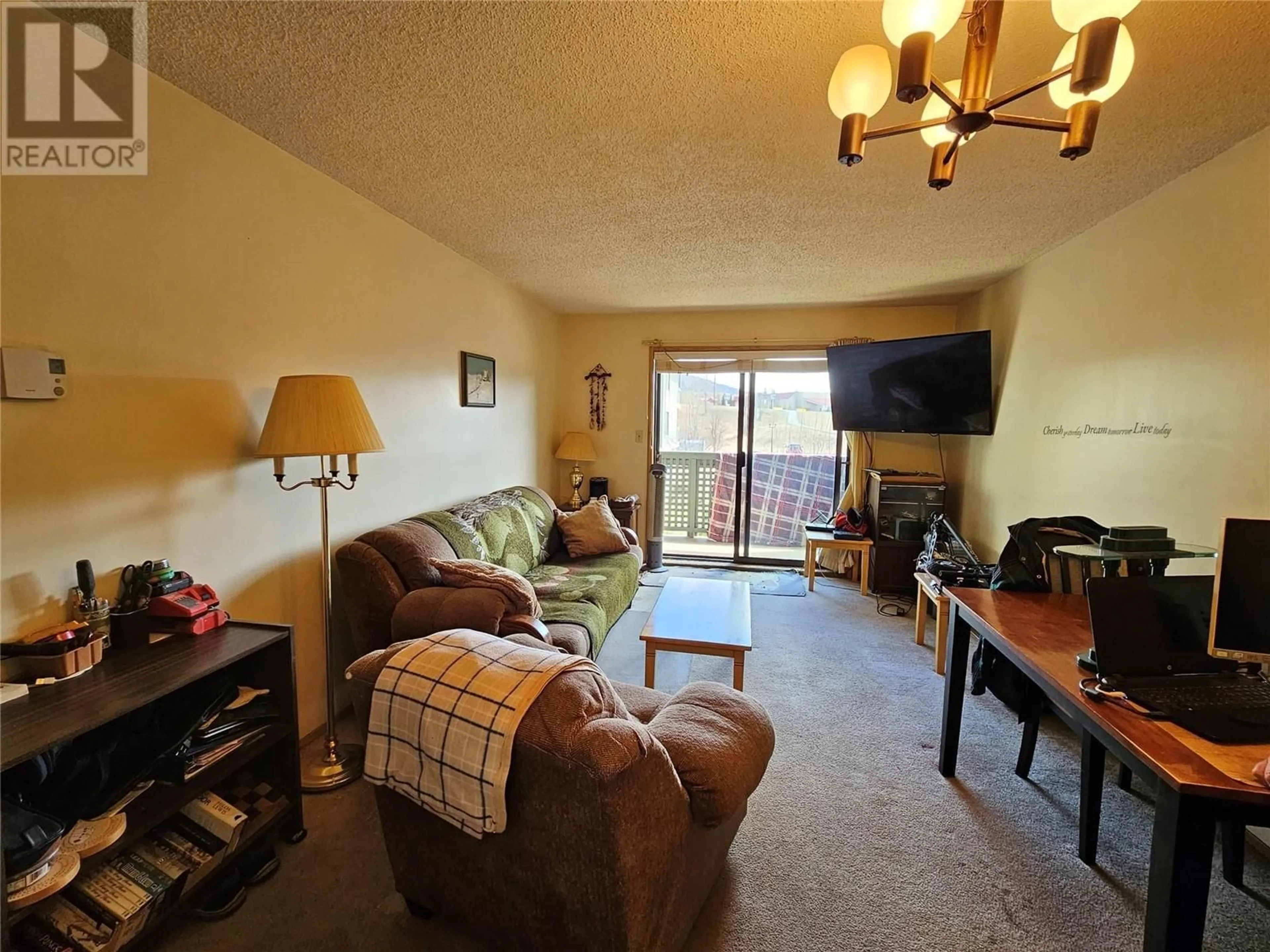 Living room, wood floors for 212-185 Chamberlain Cres, Tumbler Ridge British Columbia V0C2W0