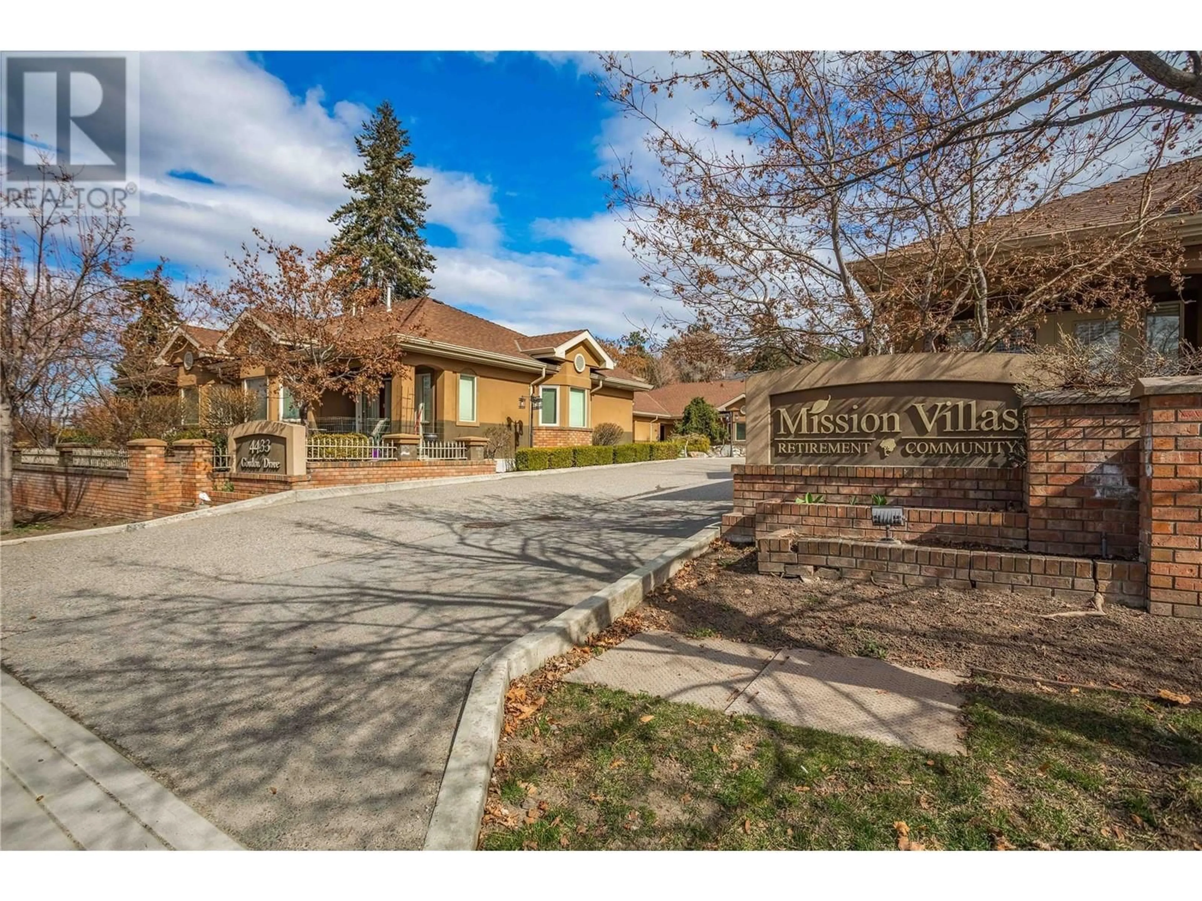 A pic from exterior of the house or condo, the fenced backyard for 4433 Gordon Drive Unit# 117, Kelowna British Columbia V1W1S9