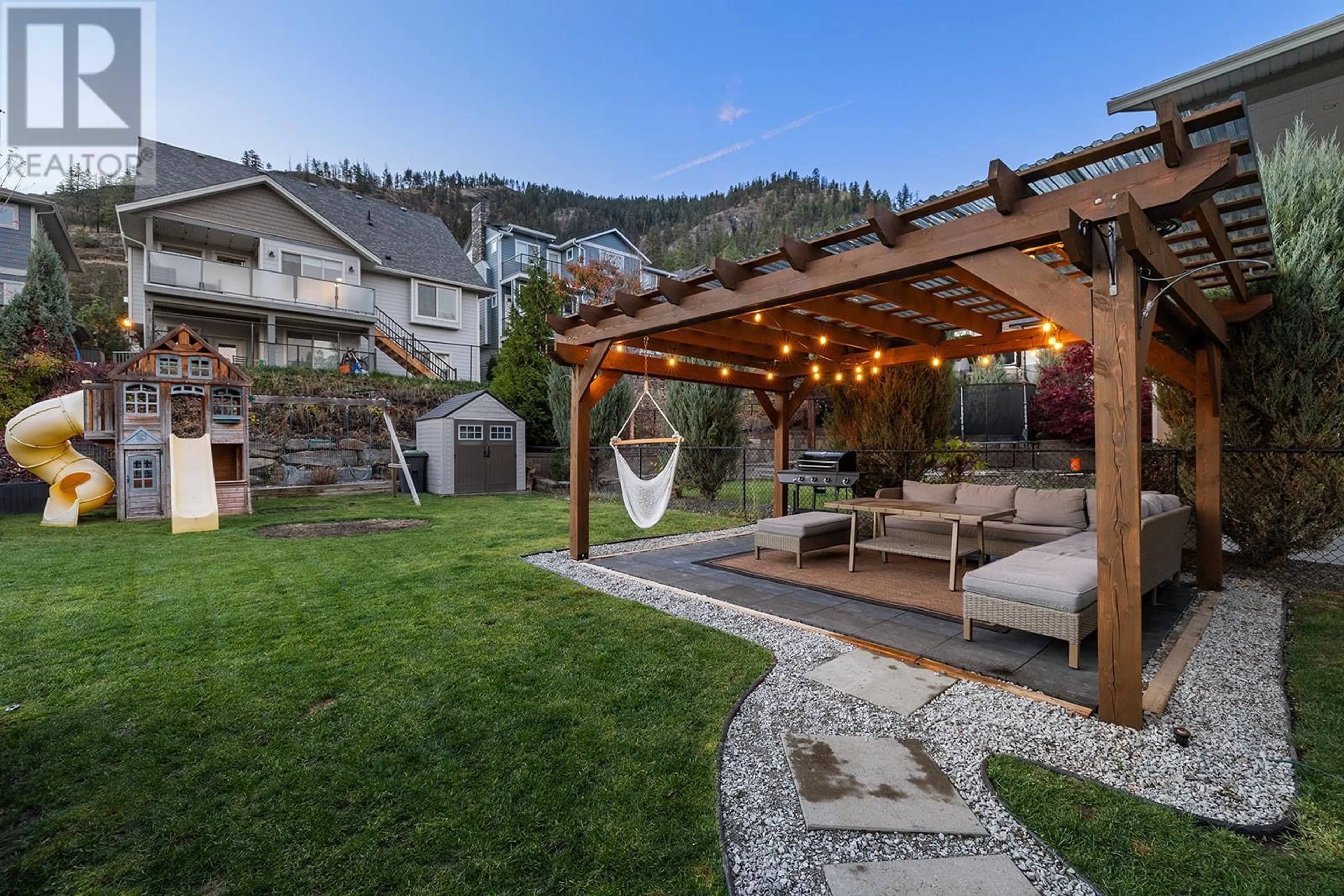 Patio, the fenced backyard for 2374 Tallus Green Crescent, West Kelowna British Columbia V4T3K4