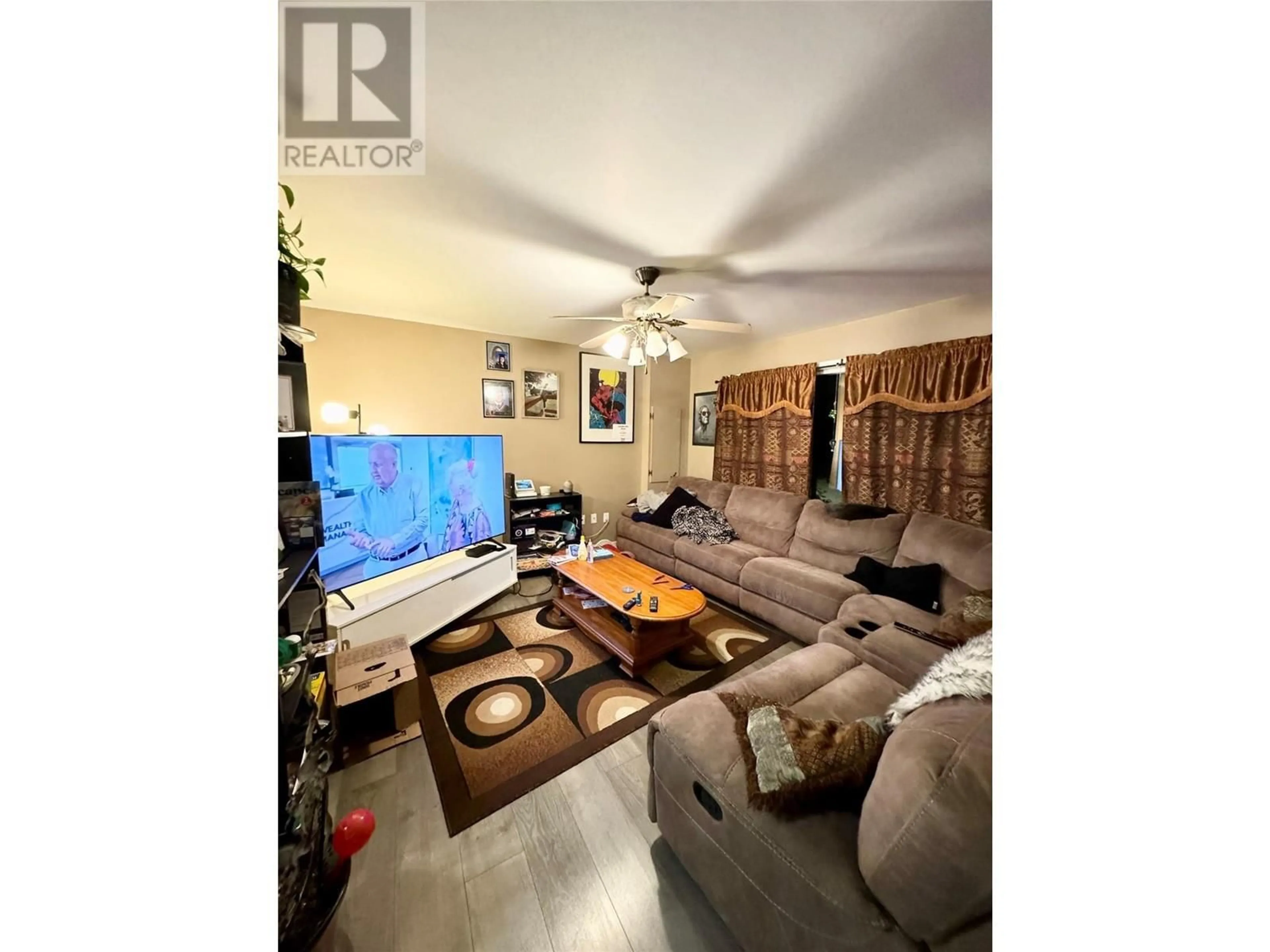Living room with furniture, wood/laminate floor for 2137 PRIEST AVENUE, Merritt British Columbia V1K1B8